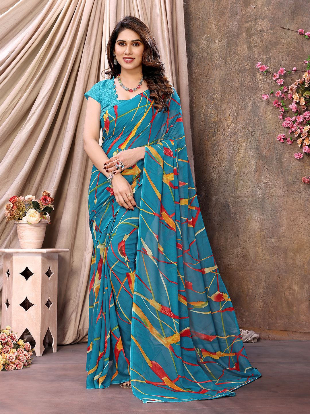 

Moda Rapido Abstract Printed Pure Georgette Saree, Blue