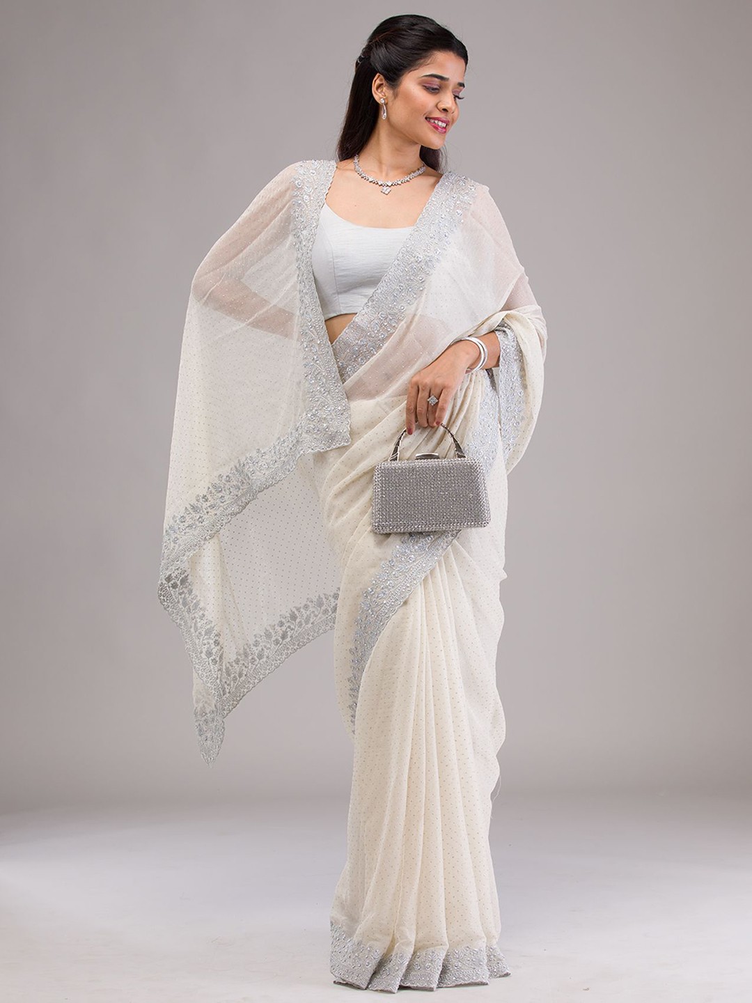

Koskii Ethnic Motifs Embroidered Pure Georgette Saree, Beige