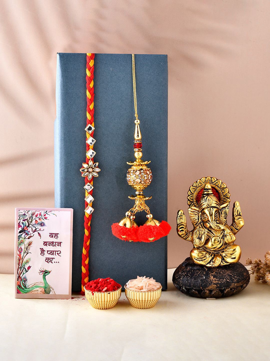

CraftVatika Unisex Set Of 2 Rakhi & Showpiece Gift Set, Gold