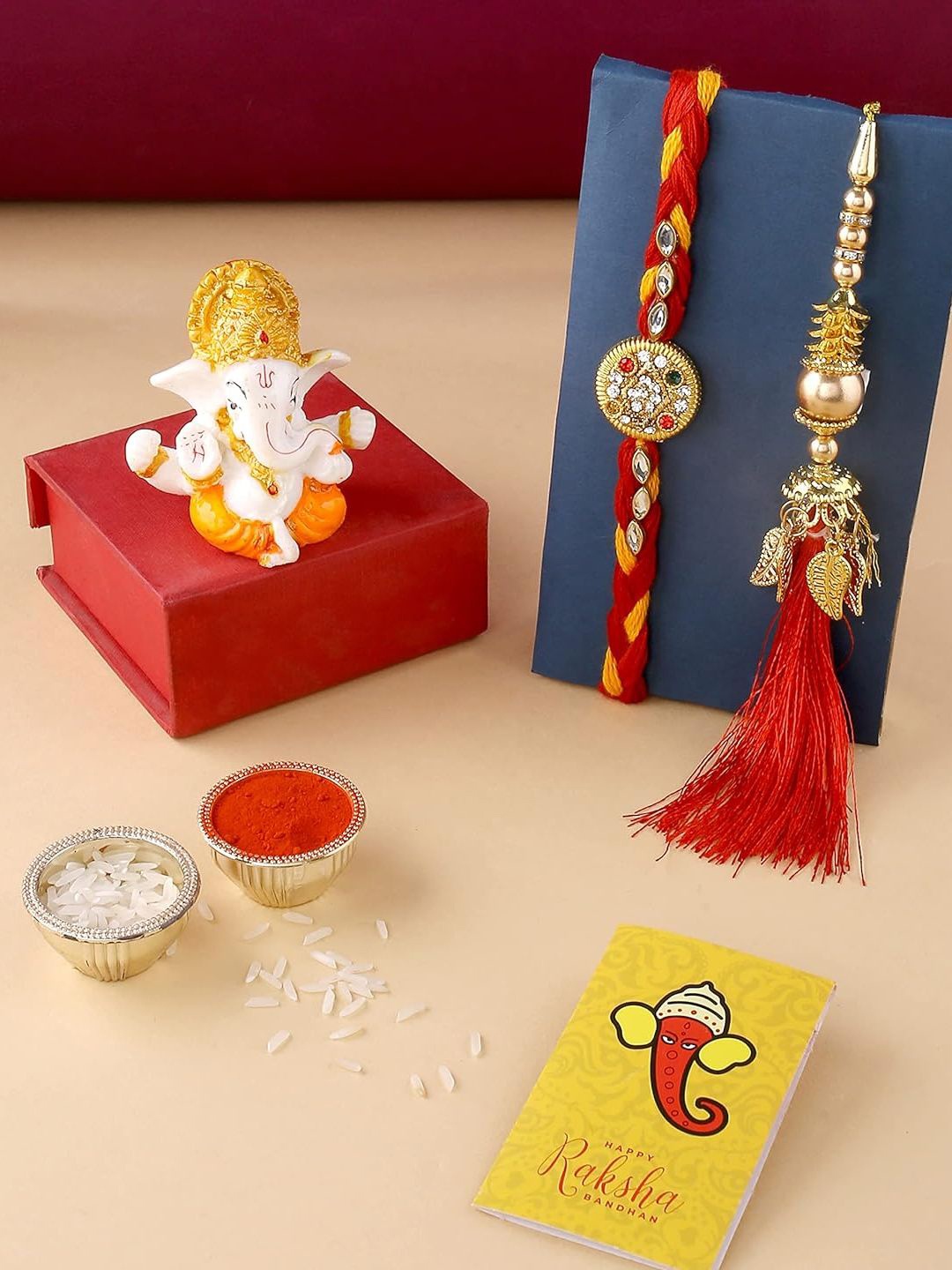 

CraftVatika Unisex Set Of 2 Rakhi & Showpiece Gift Set, Red