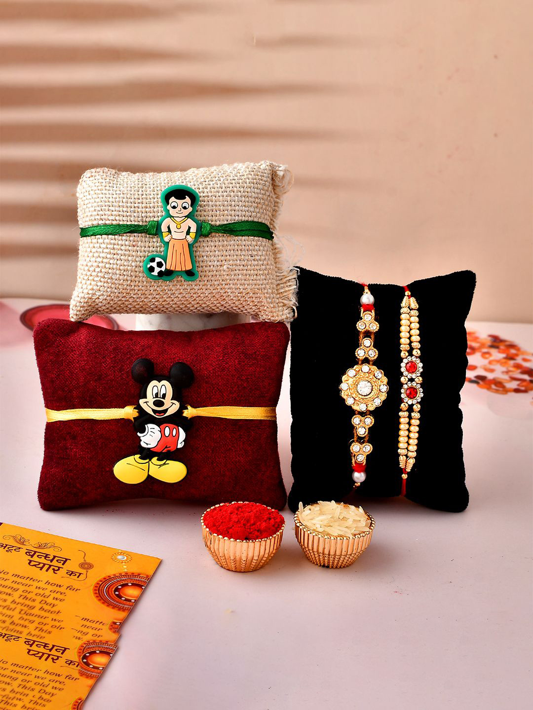 

CraftVatika Set Of 5 Stone-Studded & Beads Rakhi With Show Piece Roli & Greeting Card, Red