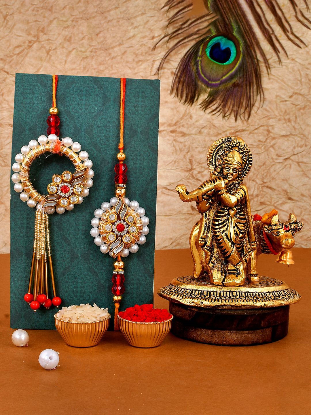 

CraftVatika Set Of 3 Stone Studded & Beaded Rakhi With Krishna Idol & Roli Chawal, Red