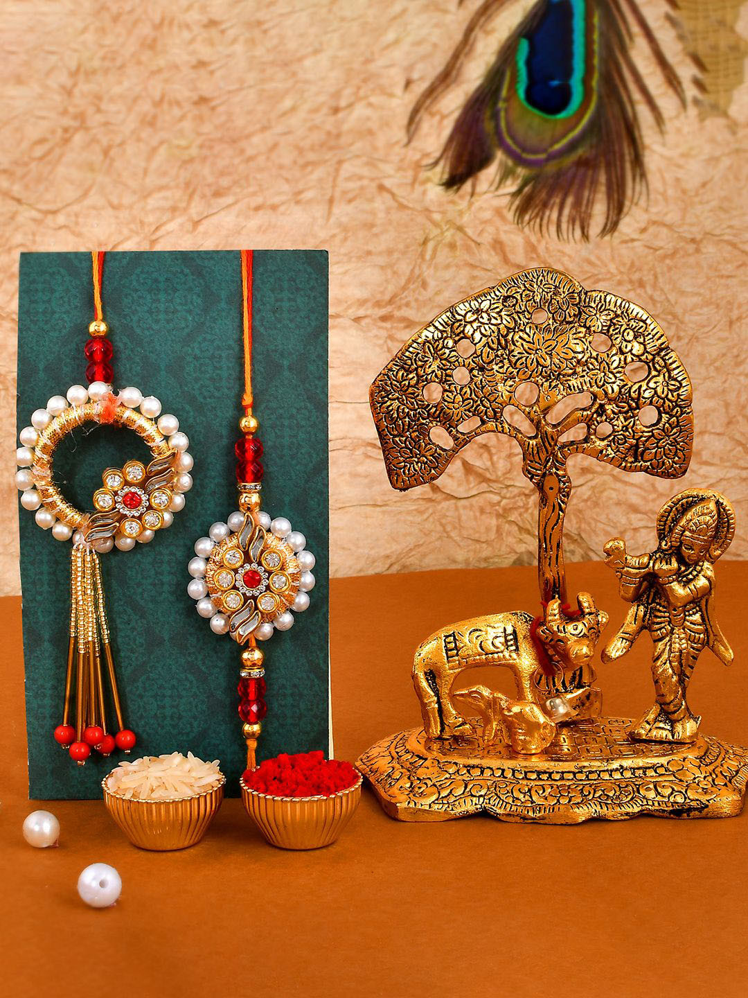 

CraftVatika Set Of 3 Rakhis With Elephant Candle Holder Showpiece With Roli Chawal, Red