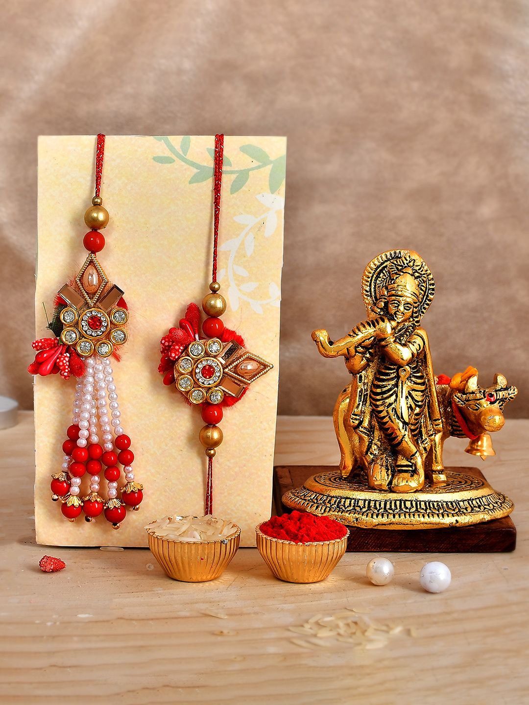 

CraftVatika Set Of 3 Rakhi With Pentbuns Radha Krishna Idol With Roli Chawal, Gold
