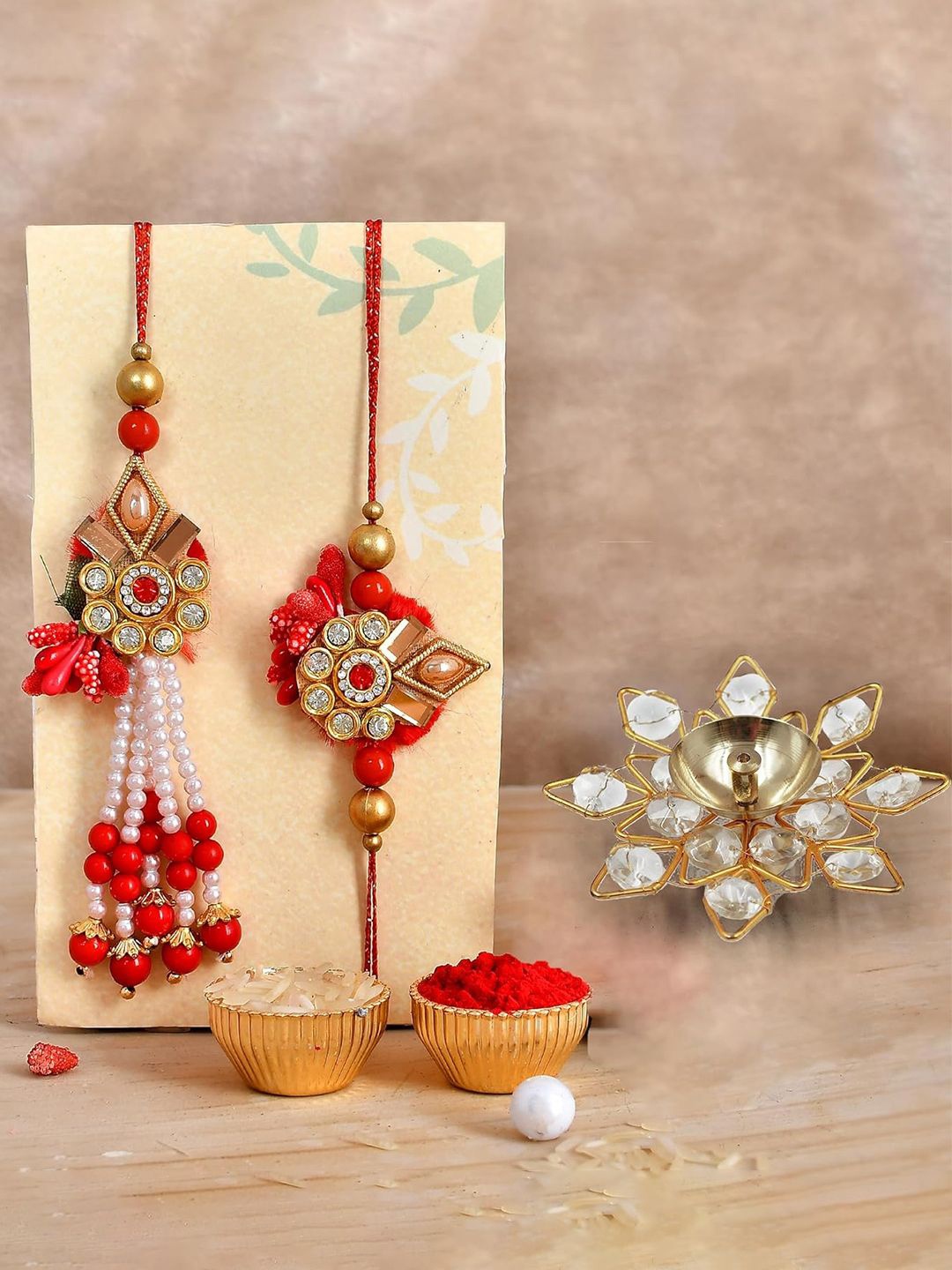 

CraftVatika Set Of 3 Rakhi With Crystal Diya & Greetings Card, Gold