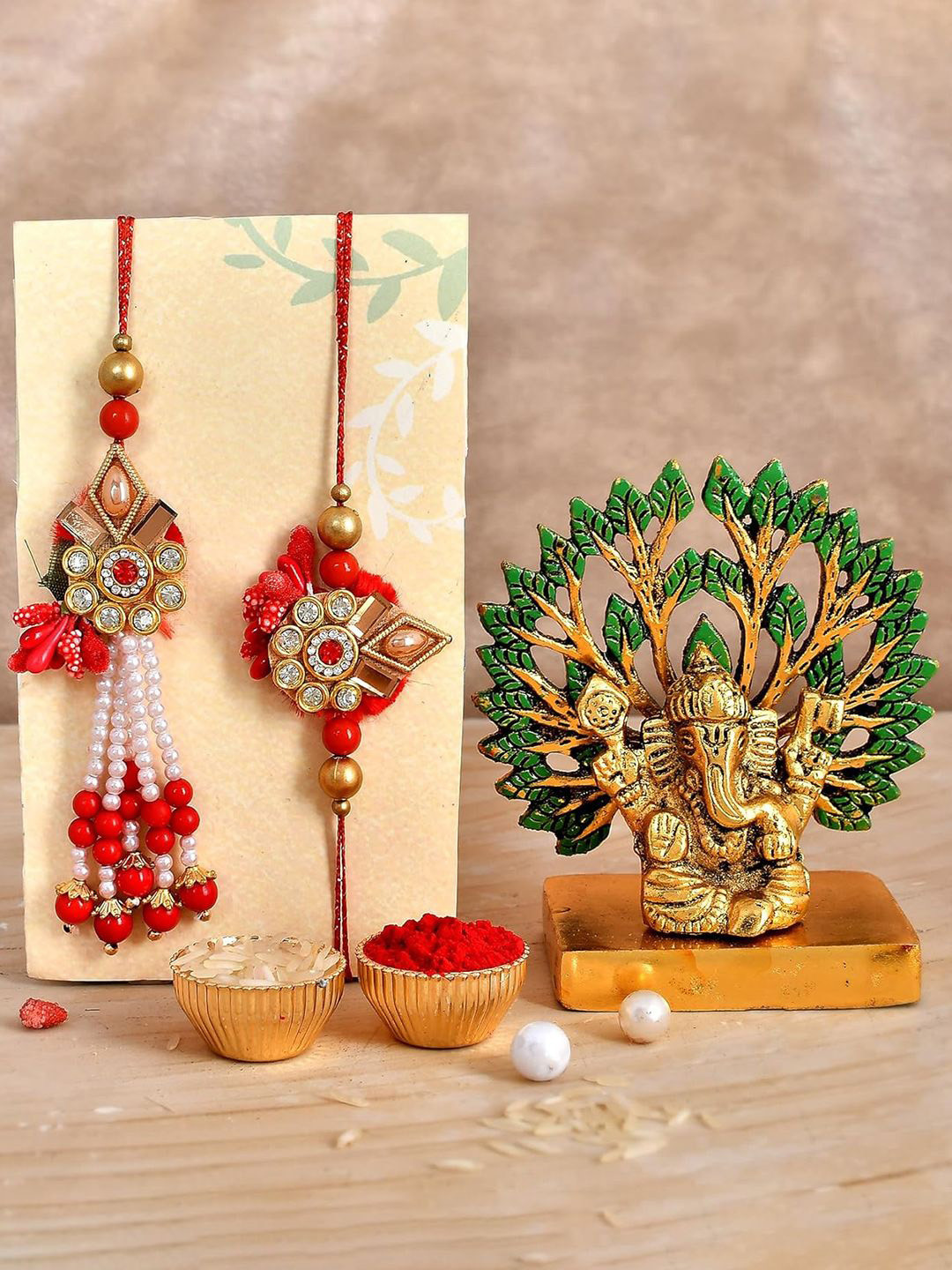 

CraftVatika Set of 3 Rakhis with Lord Ganesh Idol & Greetings Card with Roli Chawal, Red