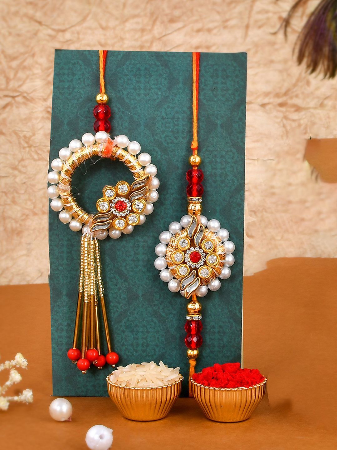 

CraftVatika Set Of 3 Stone Studded Rakhis With Lord Ganesh Idol & Greetings Card, Red