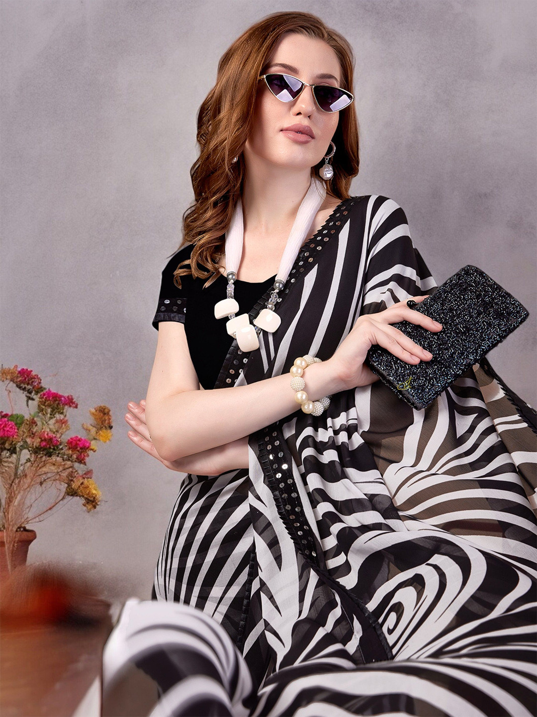 

Ambuja International Sequinned Leheriya Saree, Black