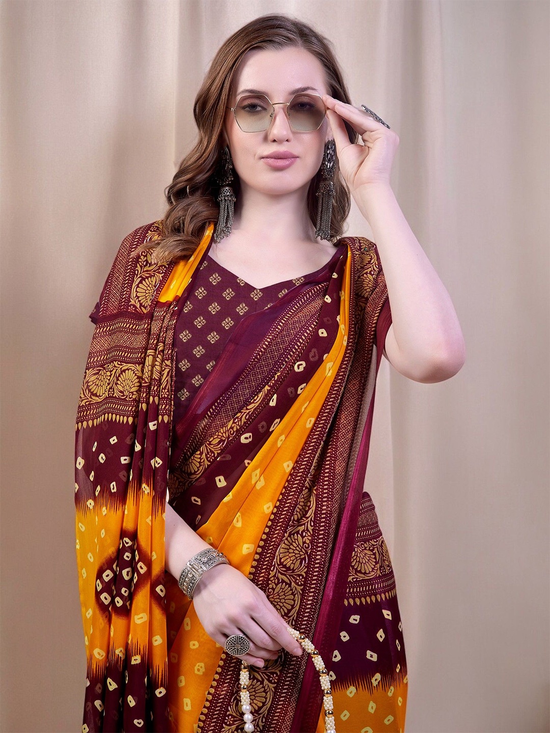 

Ambuja International Poly Georgette Bandhani Saree, Maroon