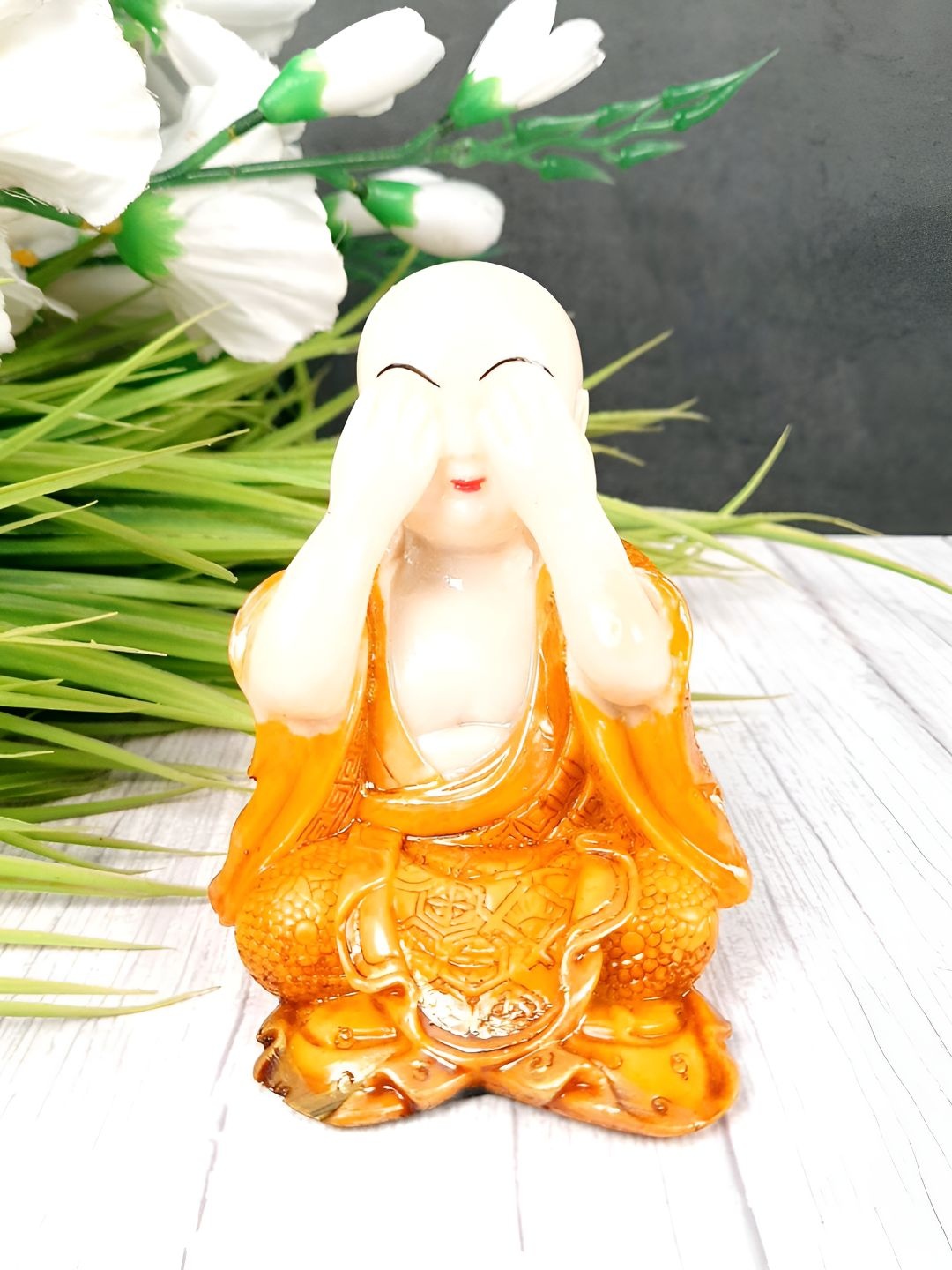 

apka mart White & Orange Buddha Figurine Showpiece