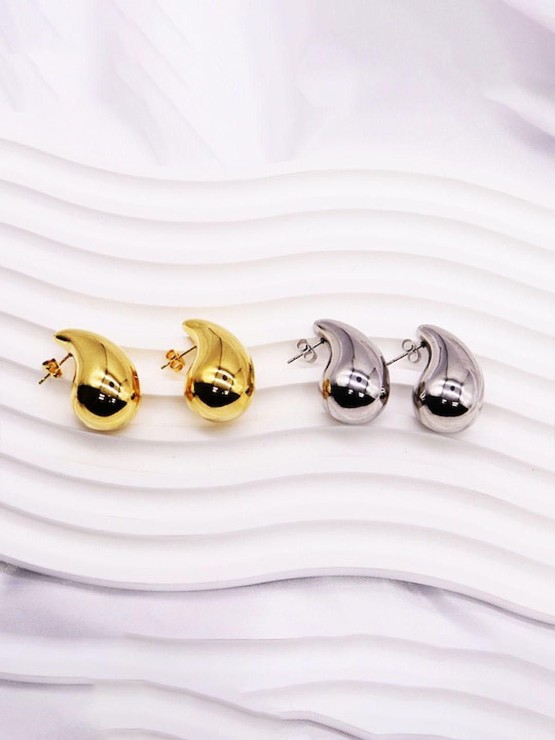 

Xivir Pack of 2 Gold-Plated Stainless Steel Teardrop Shaped Studs Earrings, Multi