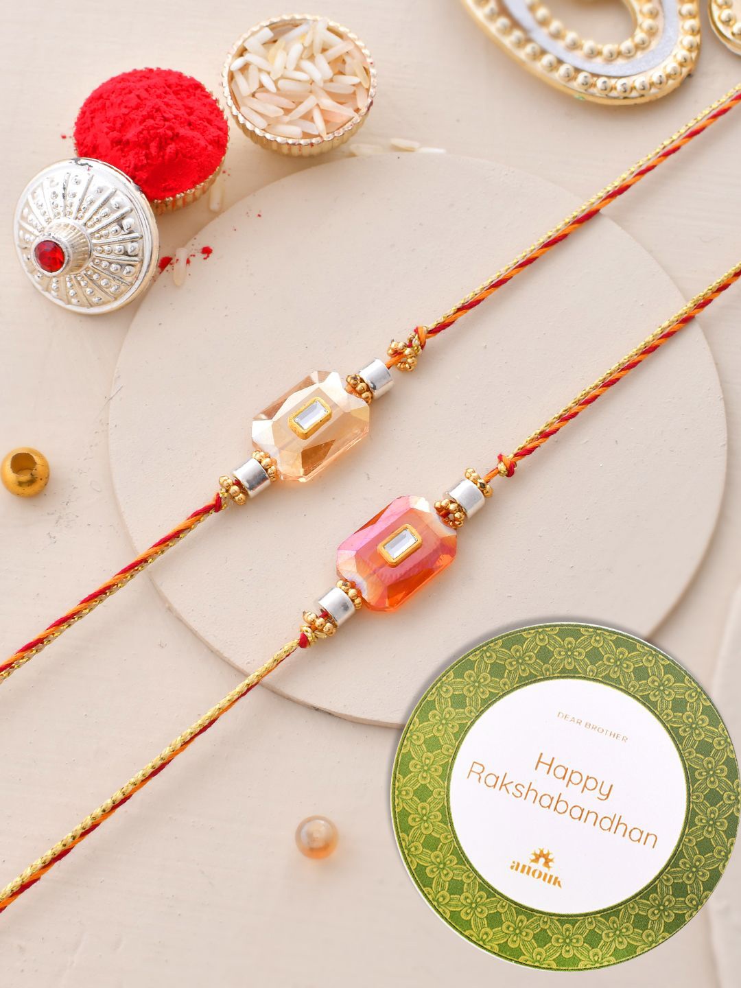 

Anouk Set of 2 Red Kundan-Studded & Beaded Thread Rakhi
