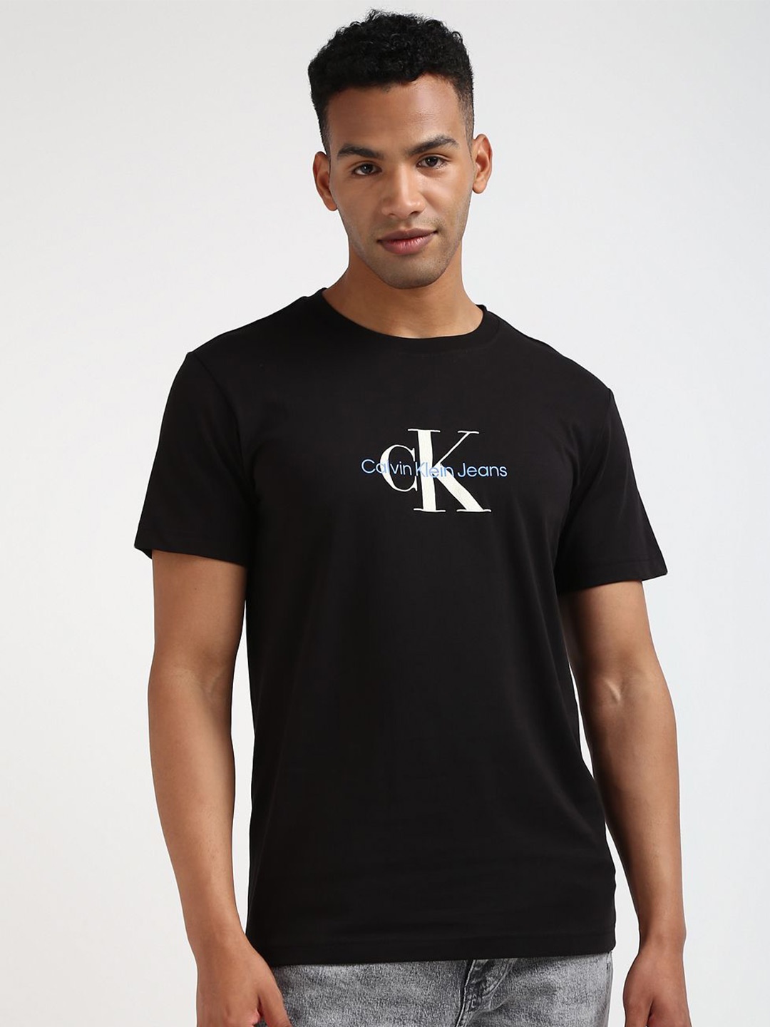 

Calvin Klein Jeans Men Solid Round Neck T-shirt, Black
