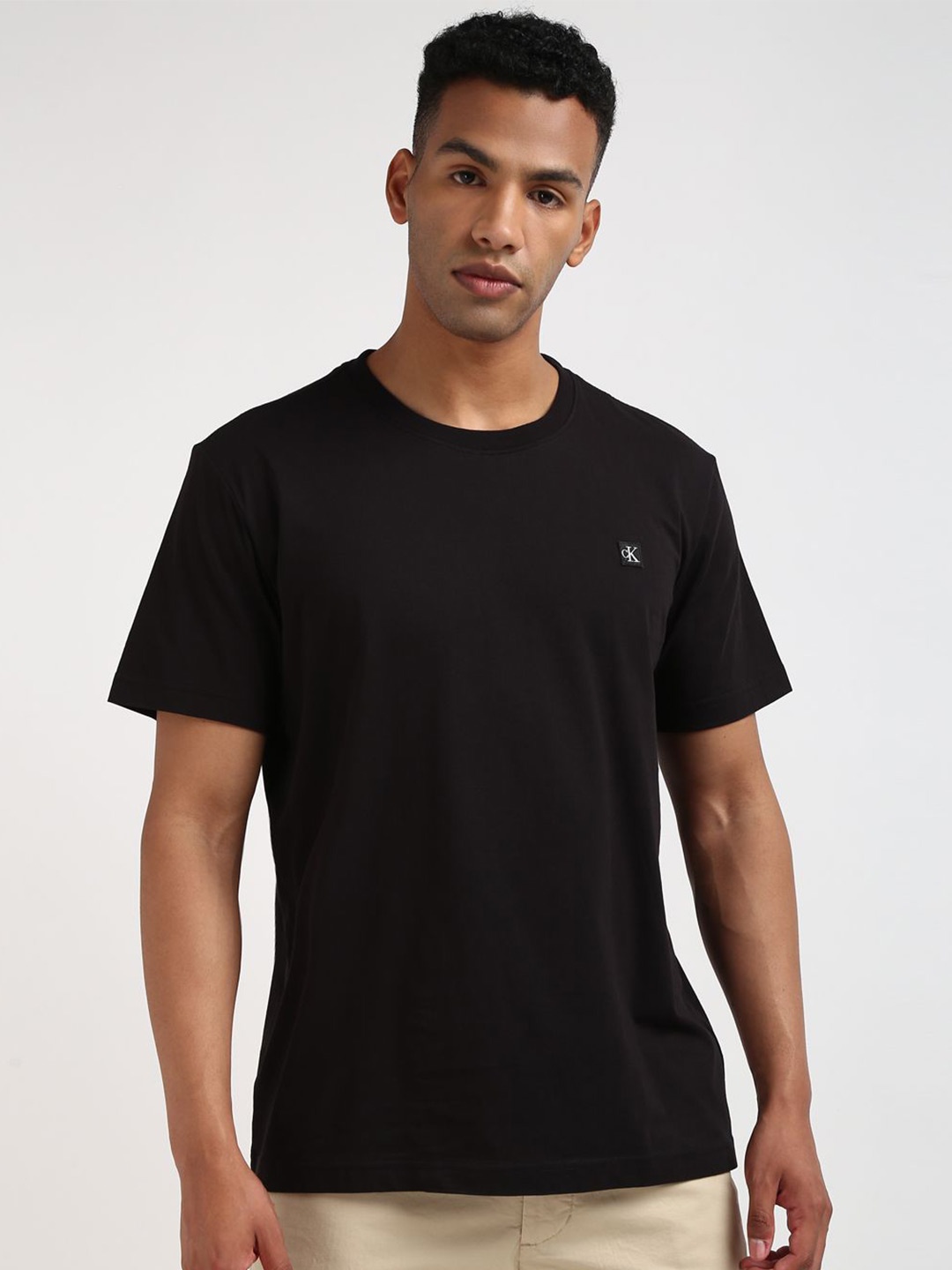 

Calvin Klein Jeans Men Solid Round Neck Cotton T-shirt, Black