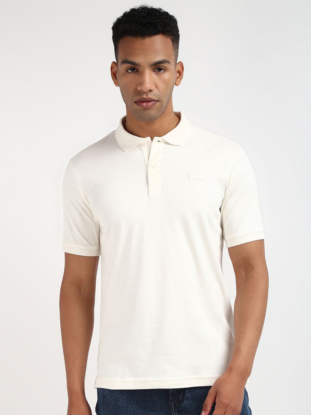 

Calvin Klein Men Solid Polo Collar Cotton T-shirt, Cream