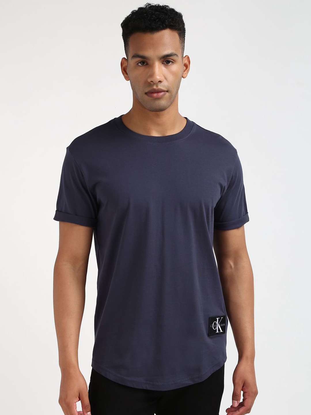 

Calvin Klein Jeans Men Solid Round Neck Applique Cotton T-shirt, Blue