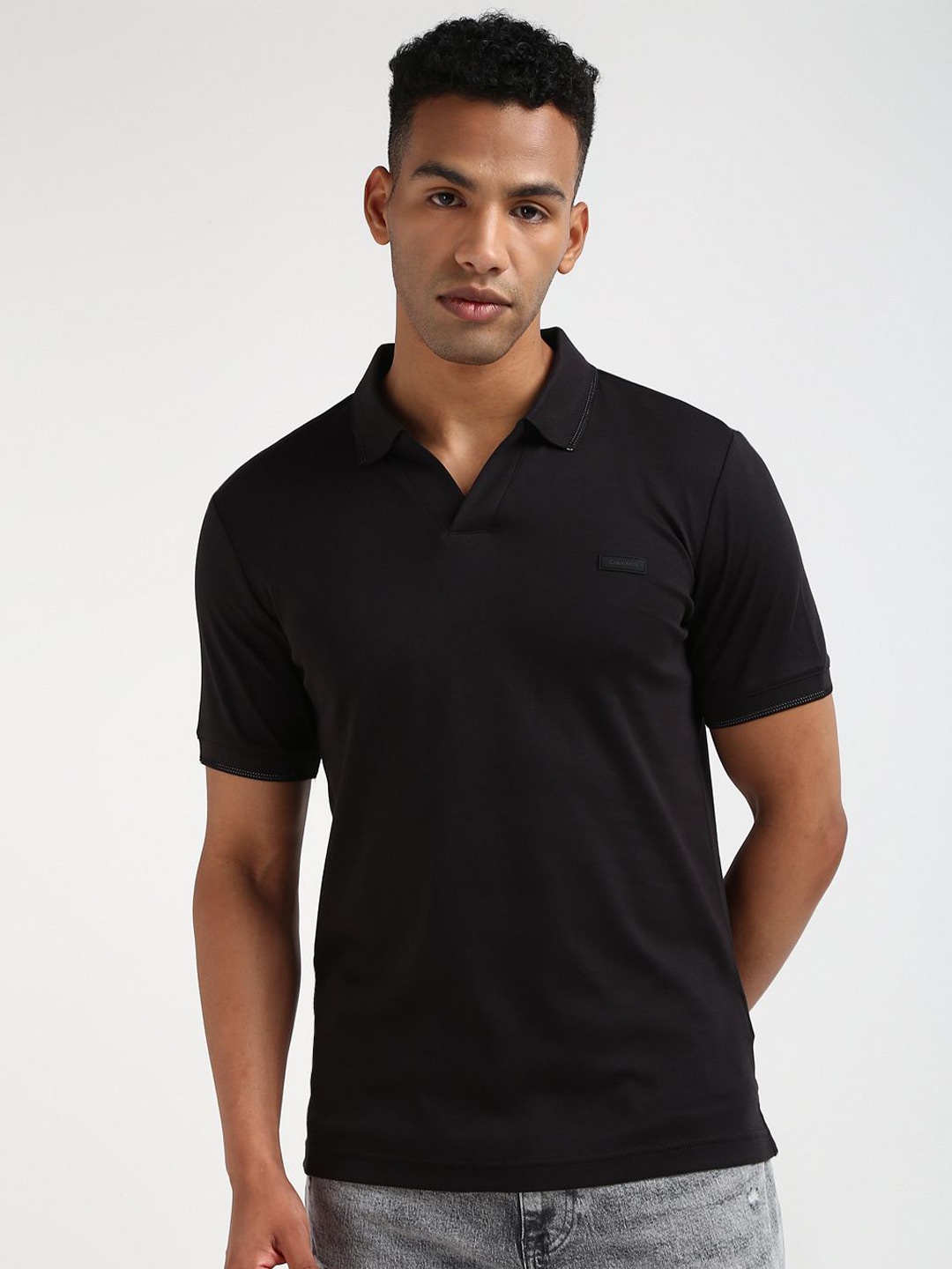 

Calvin Klein Men Solid Round Neck Polo Collar Cotton T-shirt, Black