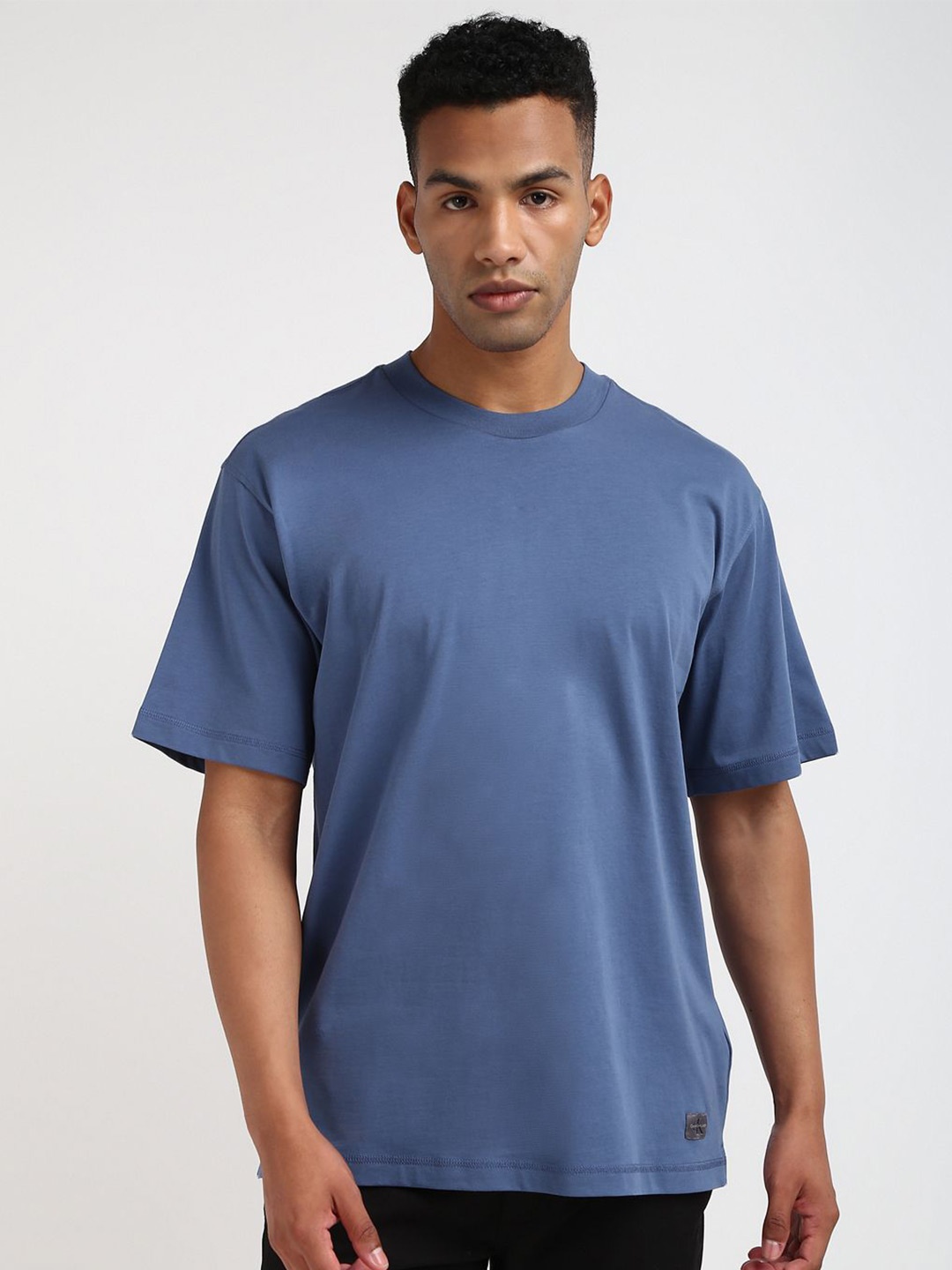 

Calvin Klein Jeans Men Solid Round Neck Cotton T-shirt, Blue
