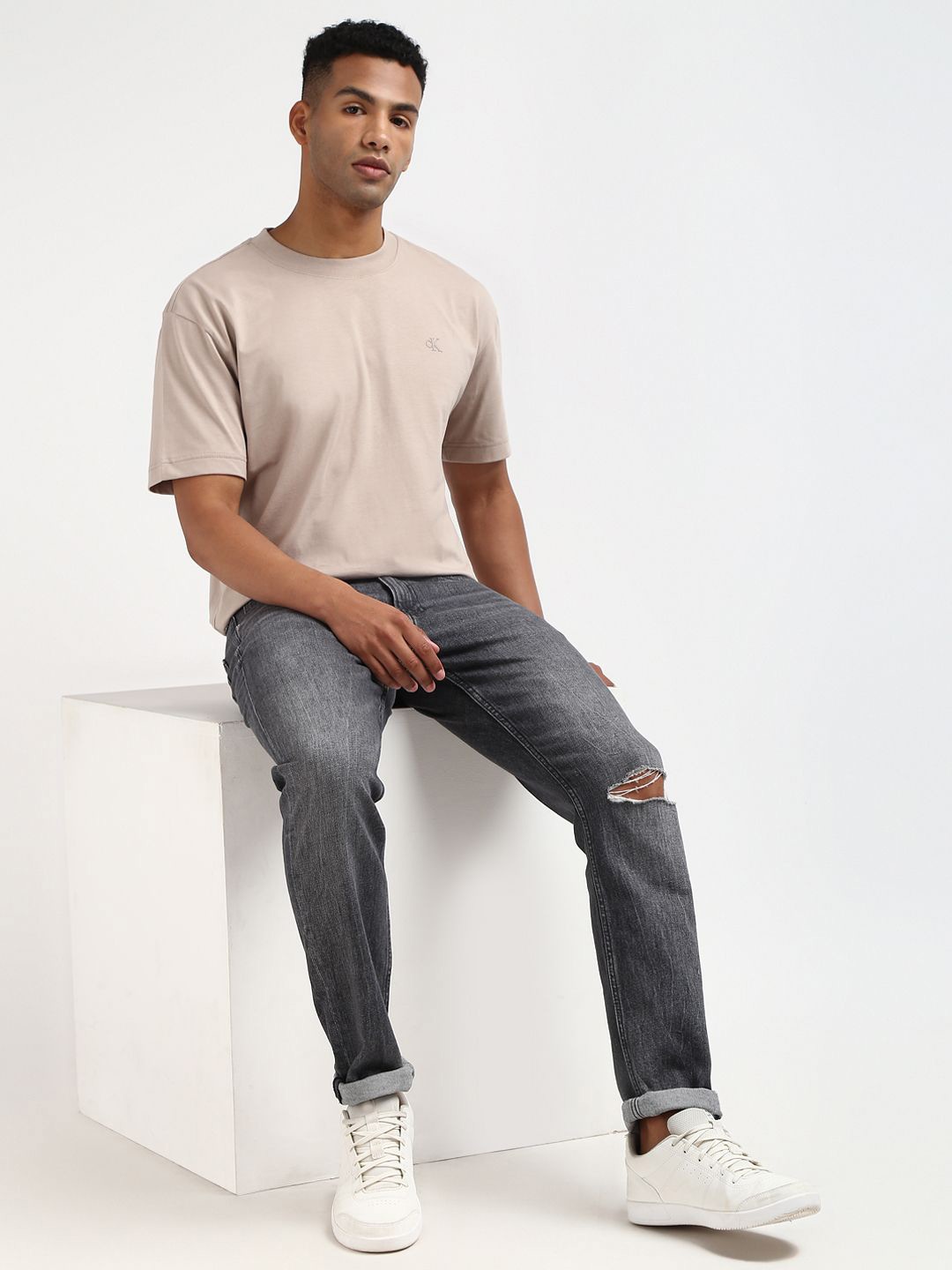 

Calvin Klein Jeans Men Solid Round Neck Cotton Oversized T-shirt, Beige