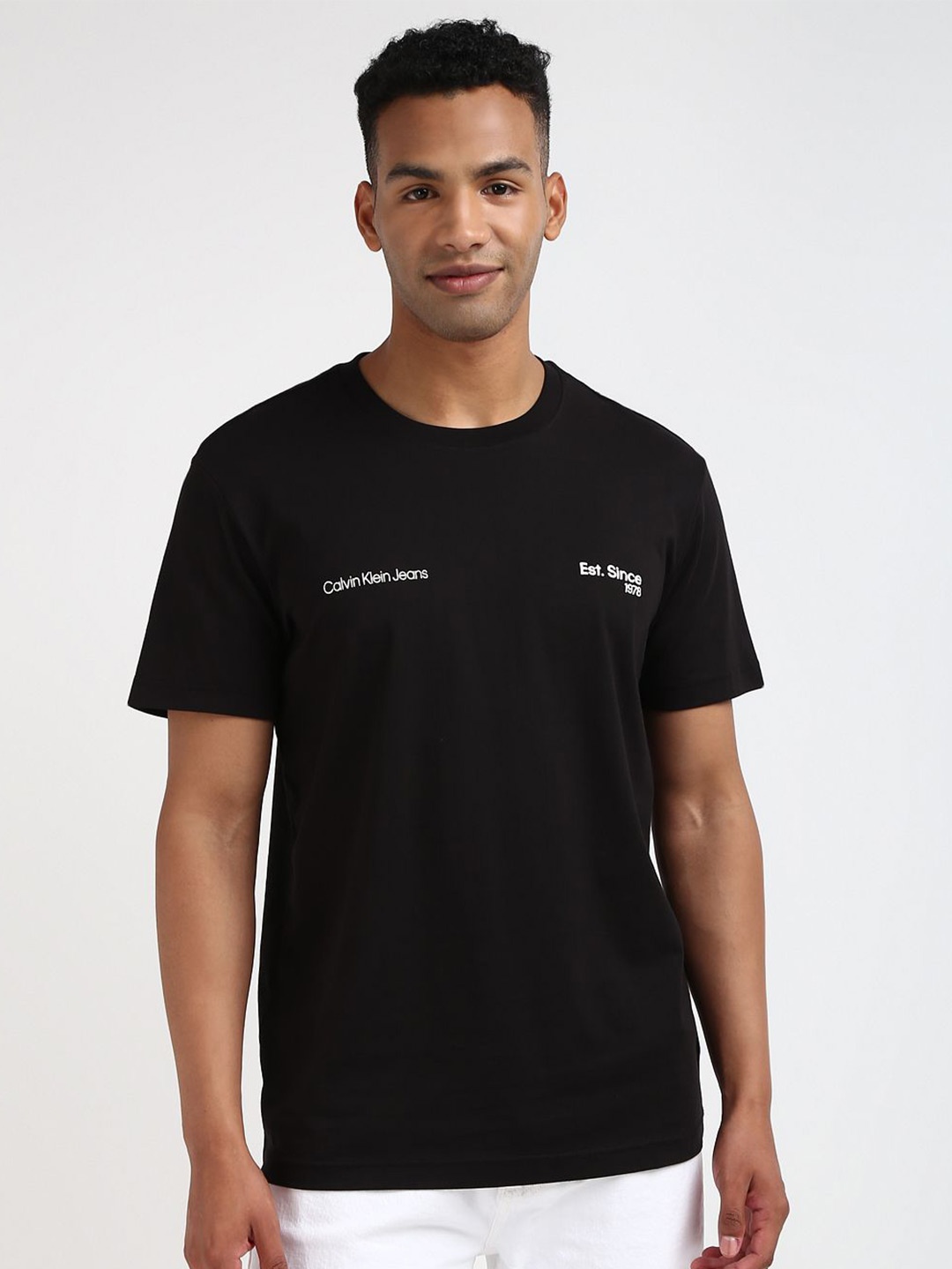 

Calvin Klein Jeans Men Solid Round Neck Cotton T-shirt, Black