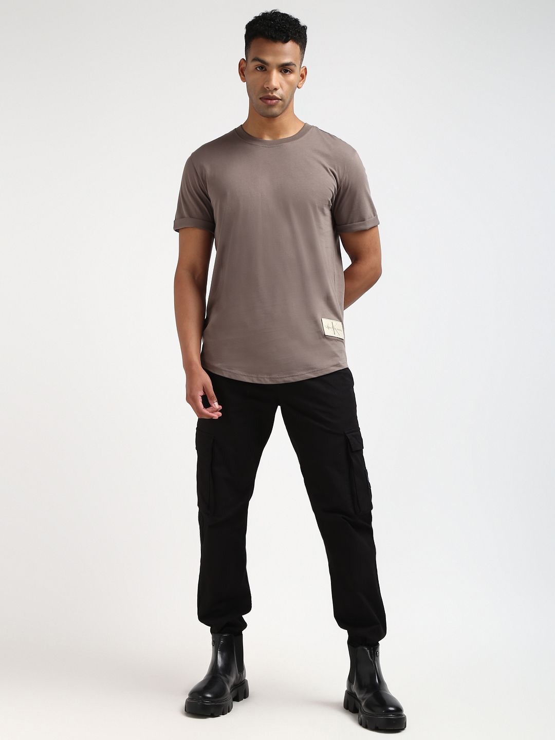 

Calvin Klein Jeans Men Solid Round Neck Applique Cotton T-shirt, Brown