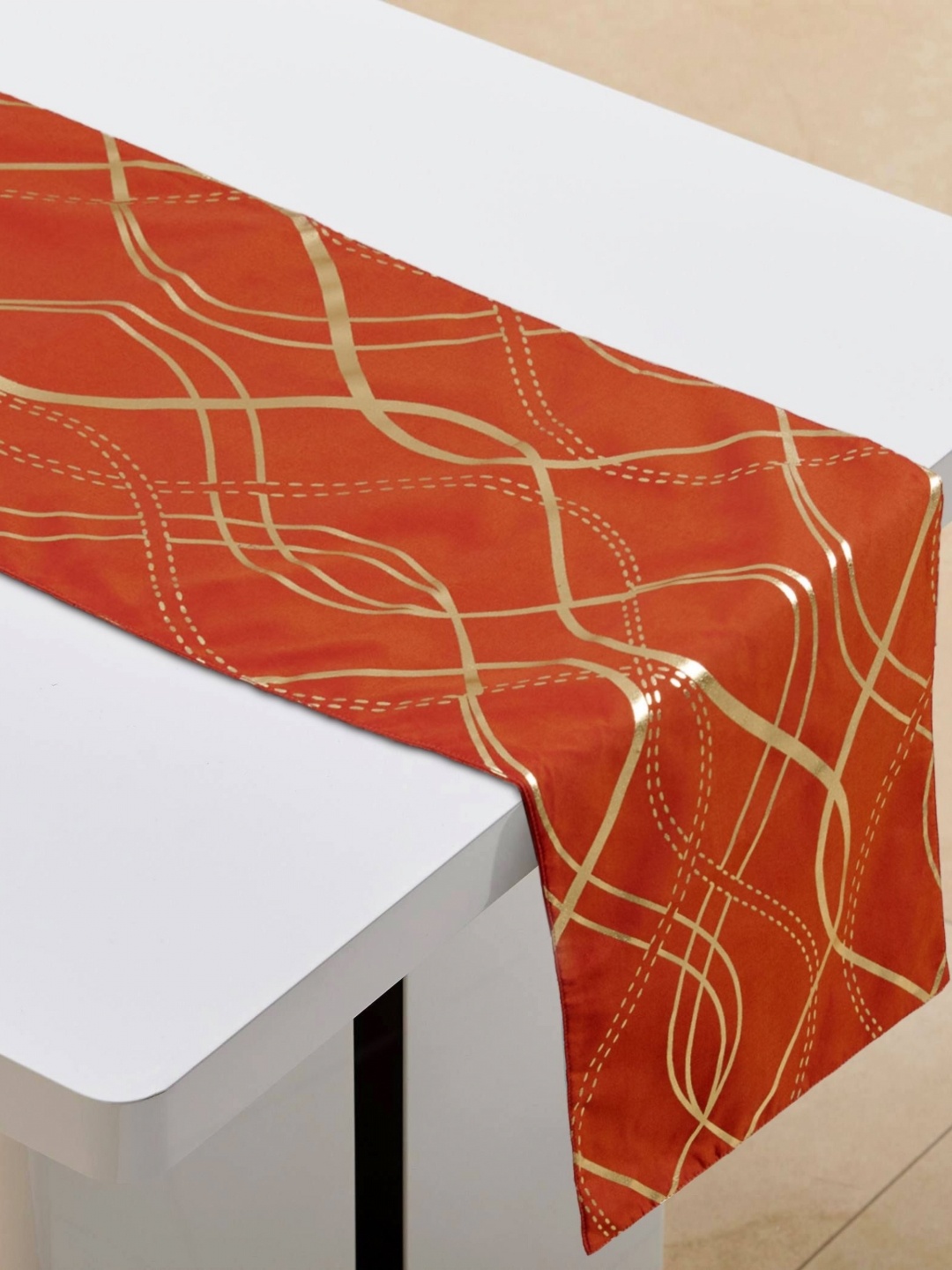 

Home Centre Orange Foil Printed Table Runner