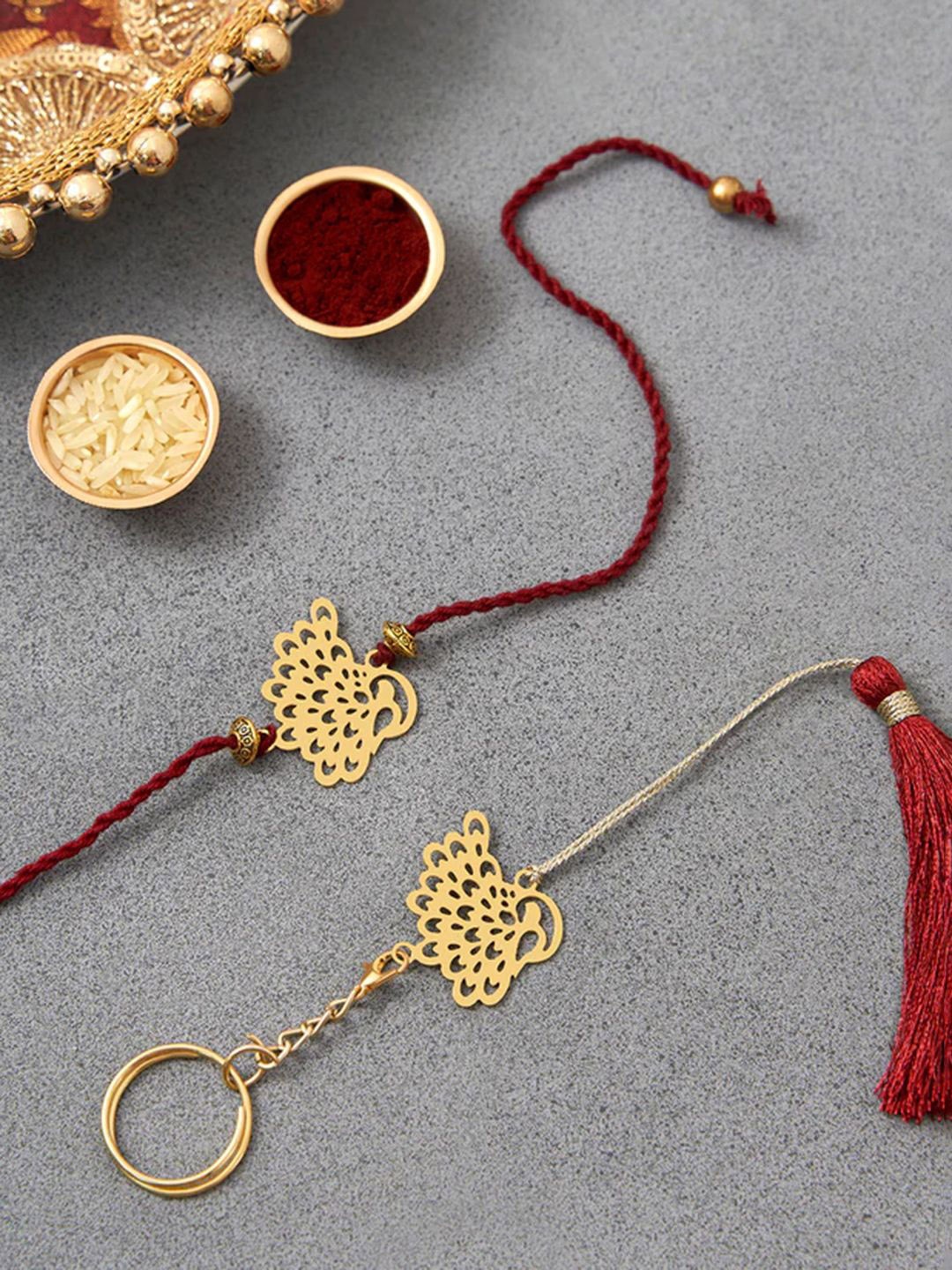 

DecorTwist Brass Peacock Design Rakhi with Keychain, Gold