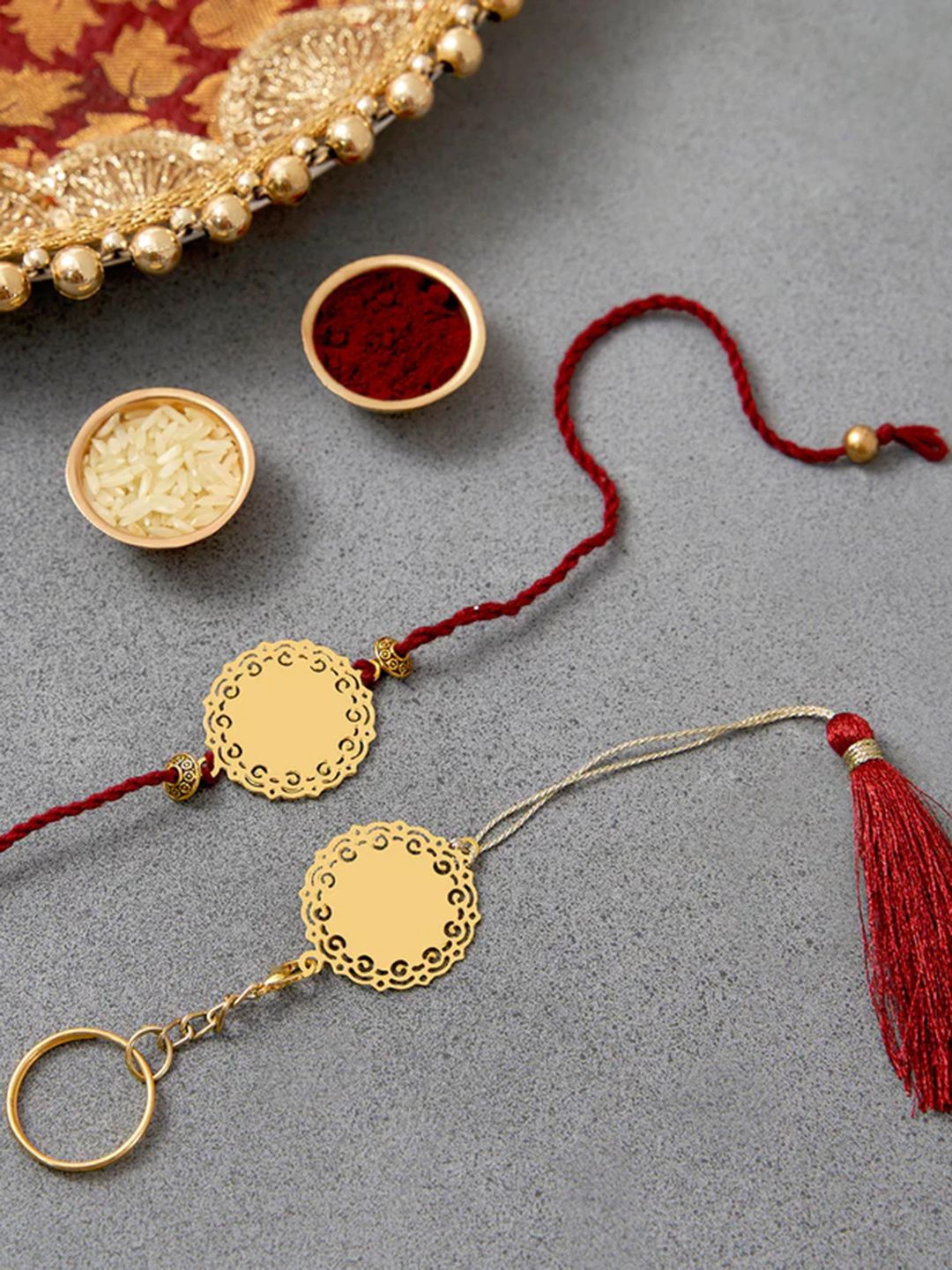 

DecorTwist Brass Sun Design Rakhi with Keychain, Gold