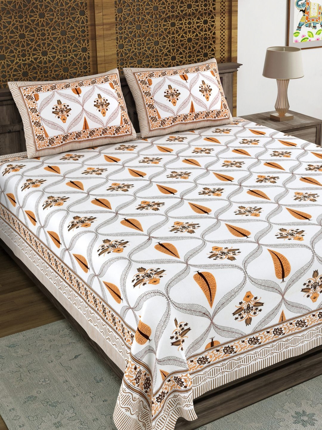 

Aura White & Orange Ethnic Motifs 120 TC King Bedsheet with 2 Pillow Covers