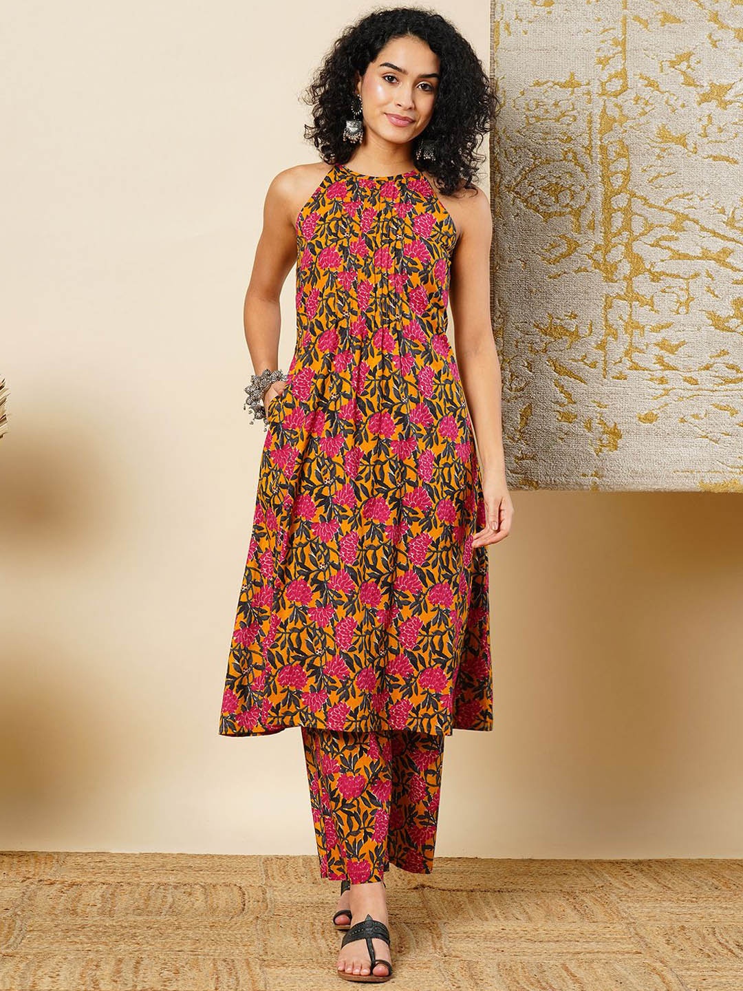 

Globus Floral Printed Halter Neck Flared Hem Pleated A-Line Fusion Kurta & Pants Sets, Yellow
