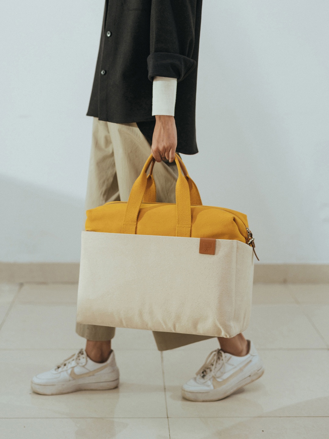 DailyObjects Oversized Structured Handheld Bag with Cut Work, Yellow