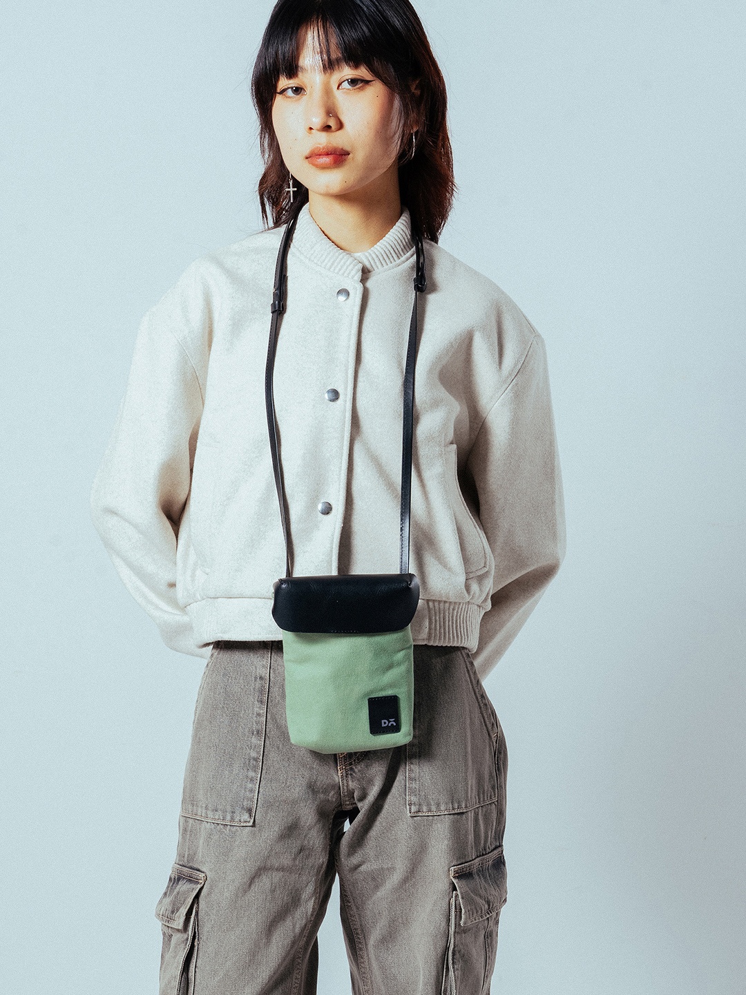 

DailyObjects Colourblocked Structured Sling Bag with Cut Work, Green