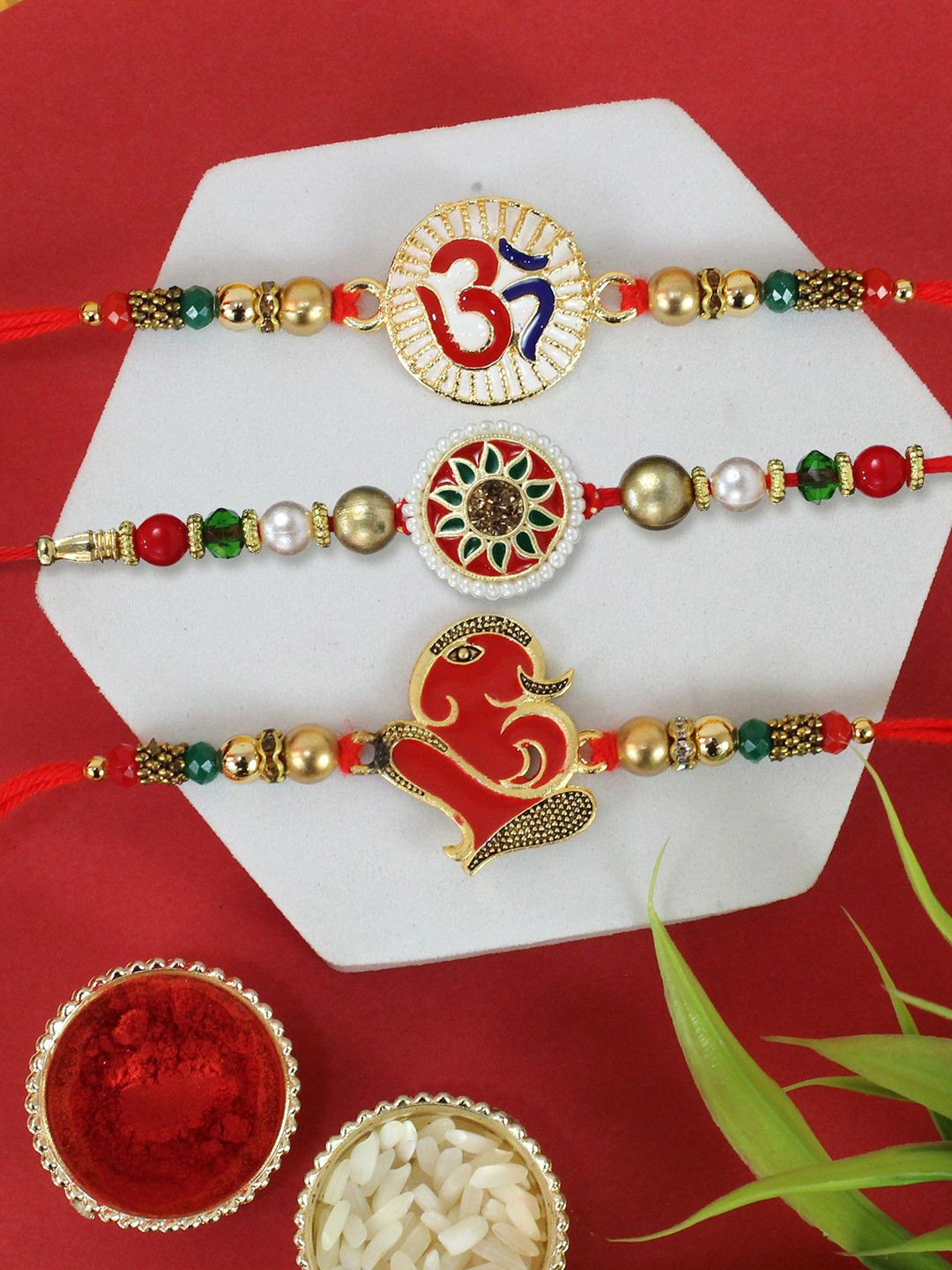 

TIED RIBBONS Set of 3 Beaded Thread Rakhis with Greeting Card & Roli Chawal, Red