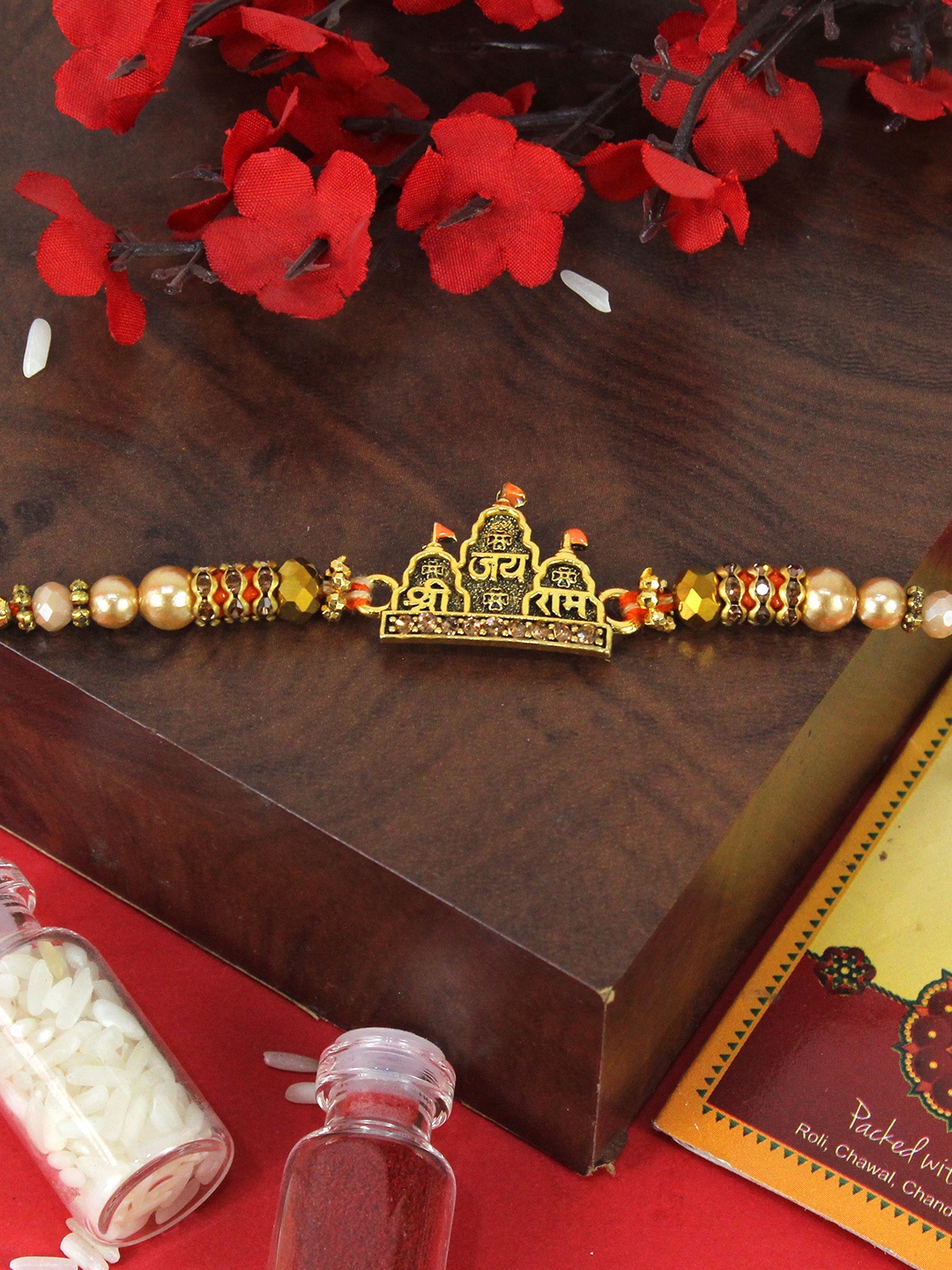 

TIED RIBBONS Lord Jai Shree Ram Beaded Thread Rakhi with Greeting Card & Roli Chawal, Gold