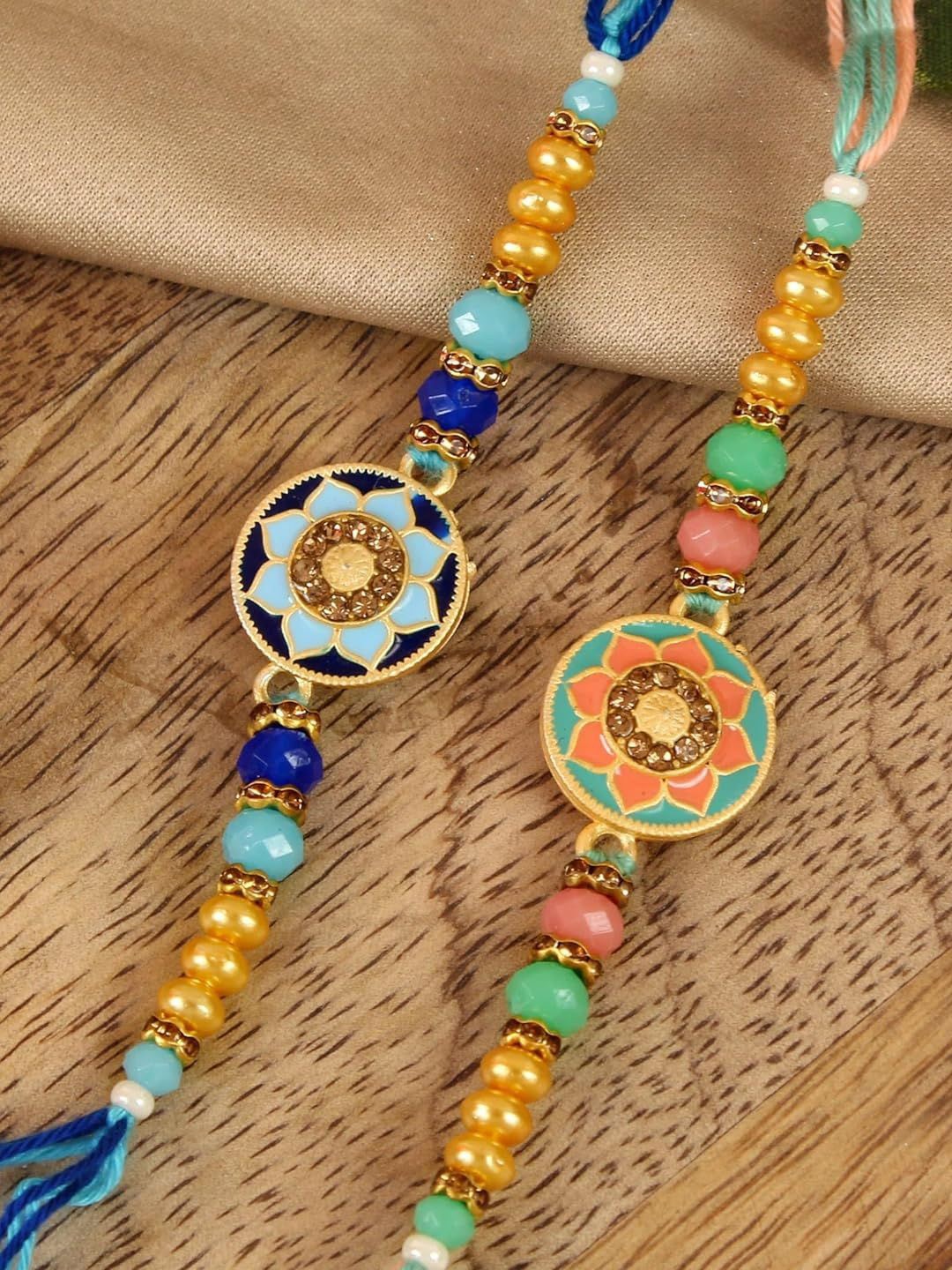 

Tied Ribbons Set of 2 Rakhi, Card & Roli Chawal Set, Gold