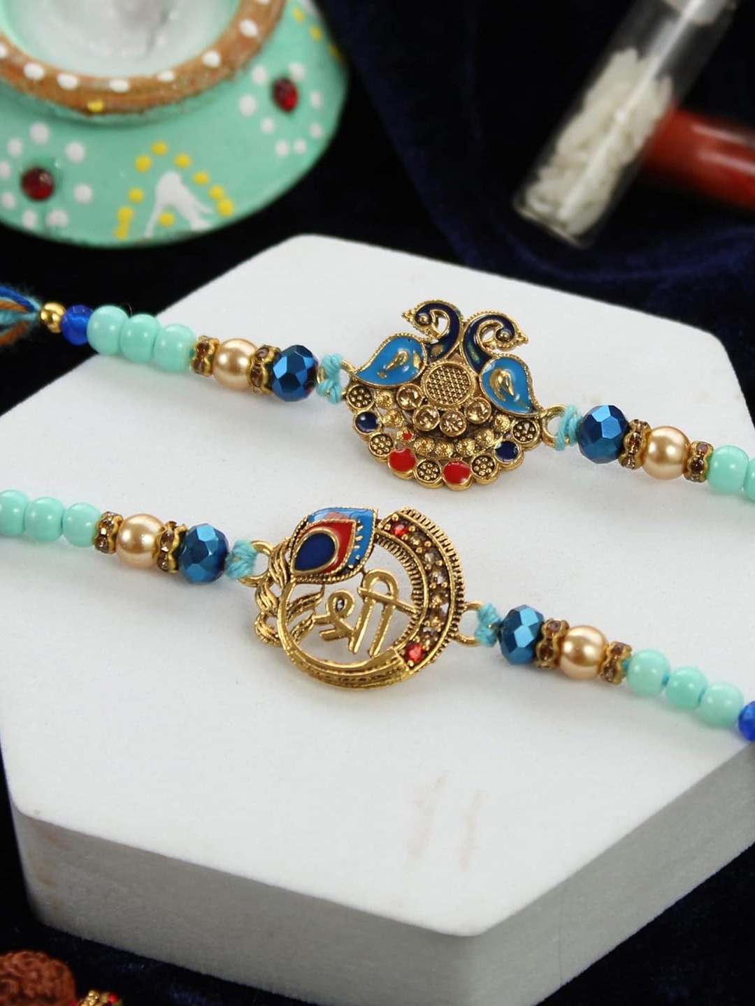 

TIED RIBBONS Set of 2 Peacock Beaded Rakhis with Card & Roli Chawal, Blue