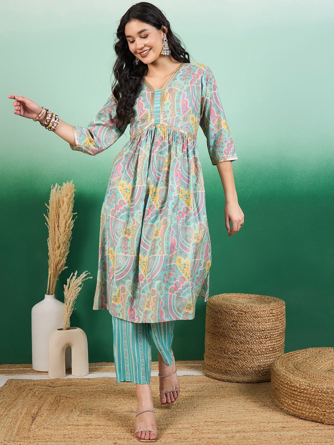 

Sangria Green Ethnic Motifs Printed Empire A-Line Kurta With Trouser