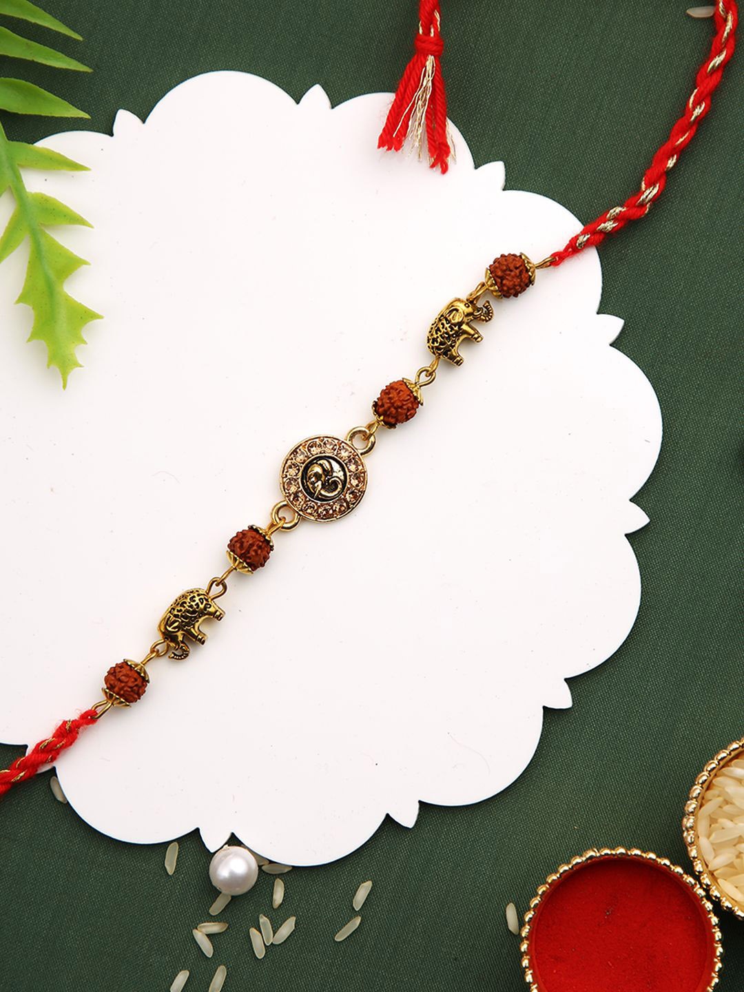 

Aapno Rajasthan Engraved Elephant Antique Thread Rakhi With Roli Chawal & Greetings Card, Gold