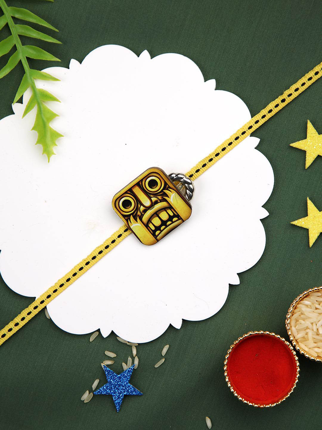 

Aapno Rajasthan Printed Thread Rakhi with Greetings Card & Roli Chawal, Yellow