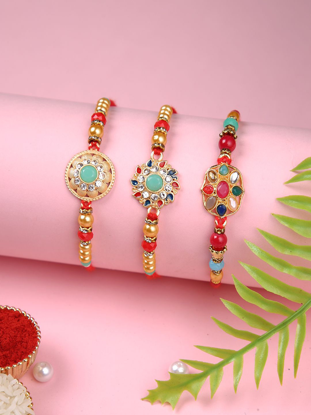 

Aapno Rajasthan Set Of 3 Beaded Thread Rakhis with Greetings Card & Roli Chawal, Red