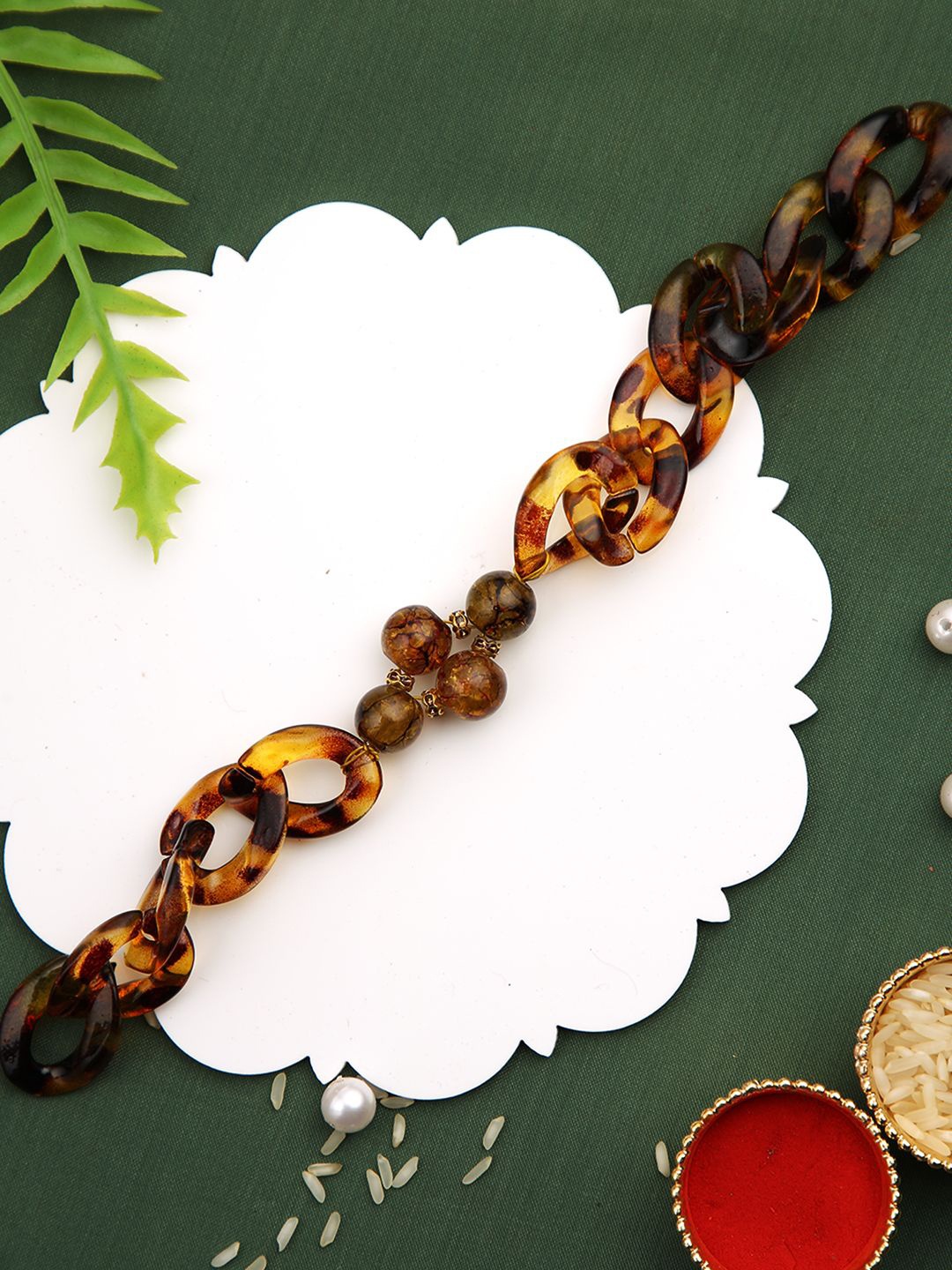 

Aapno Rajasthan Beaded Wraparound Rakhi with Roli Chawal & Greetings Card, Brown
