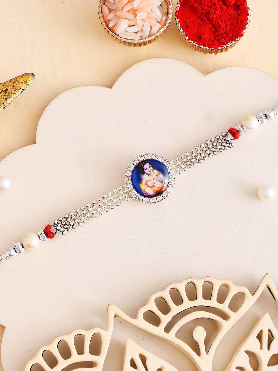 

Aapno Rajasthan American Diamond Thread Rakhi with Roli Chawal & Greetings Card, Red