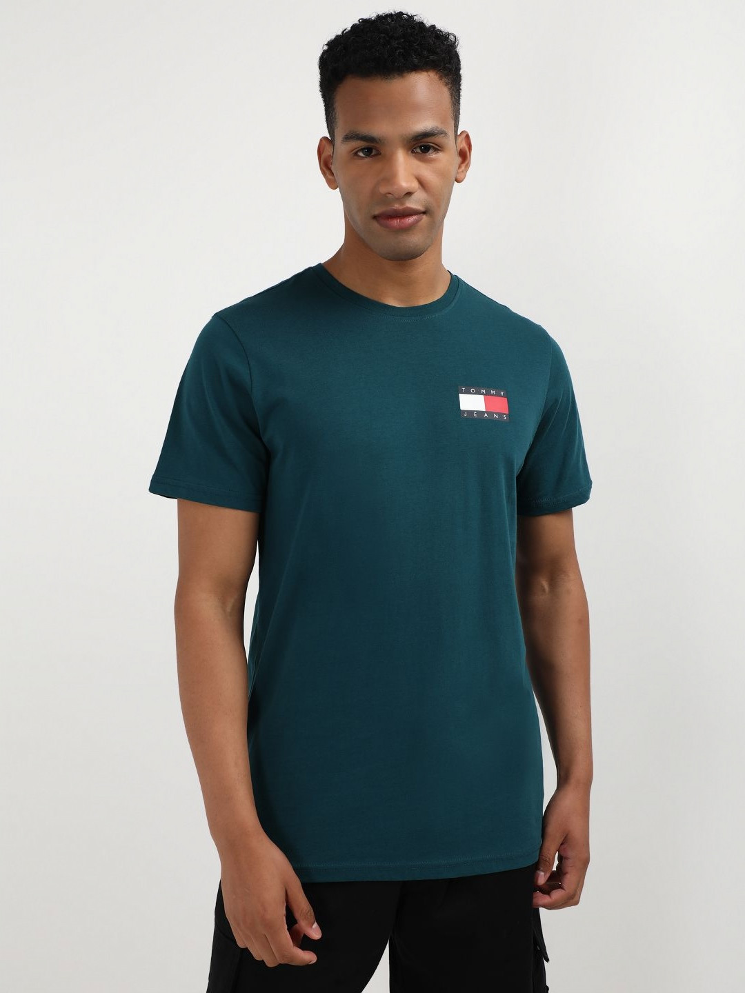 

Tommy Hilfiger Men Solid Round Neck Pure Cotton Slim Fit T-shirt, Teal