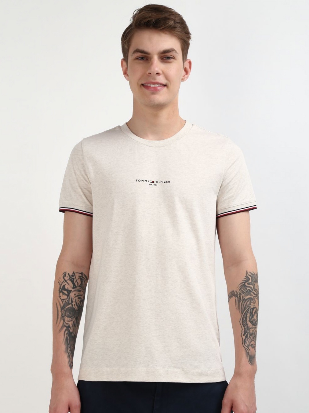 

Tommy Hilfiger Men Solid Round Neck Pure Cotton Slim Fit T-shirt, Beige