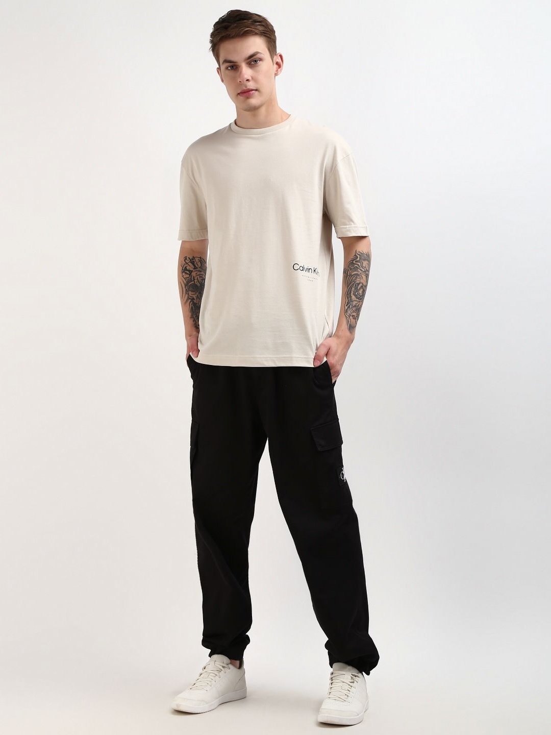 

Calvin Klein Jeans Men Solid Round Neck Cotton T-Shirt, Beige