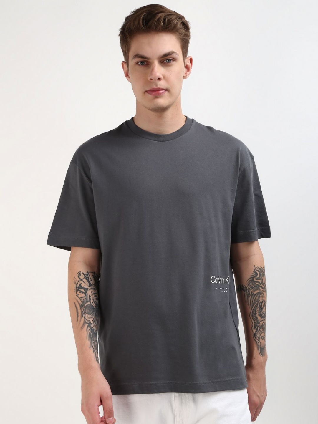 

Calvin Klein Jeans Men Solid Round Neck Cotton T-Shirt, Grey
