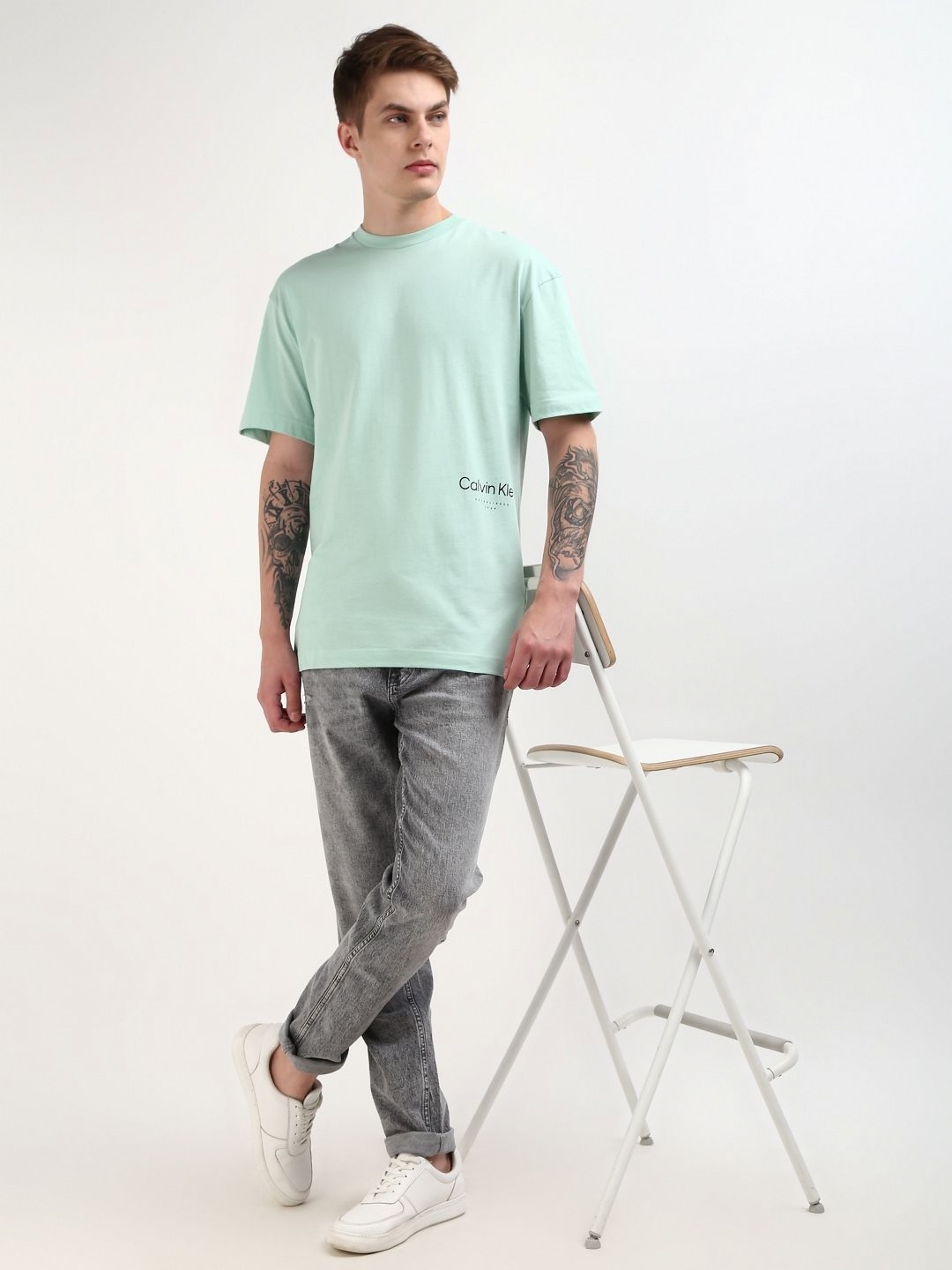 

Calvin Klein Jeans Men Solid Round Neck Cotton T-Shirt, Green