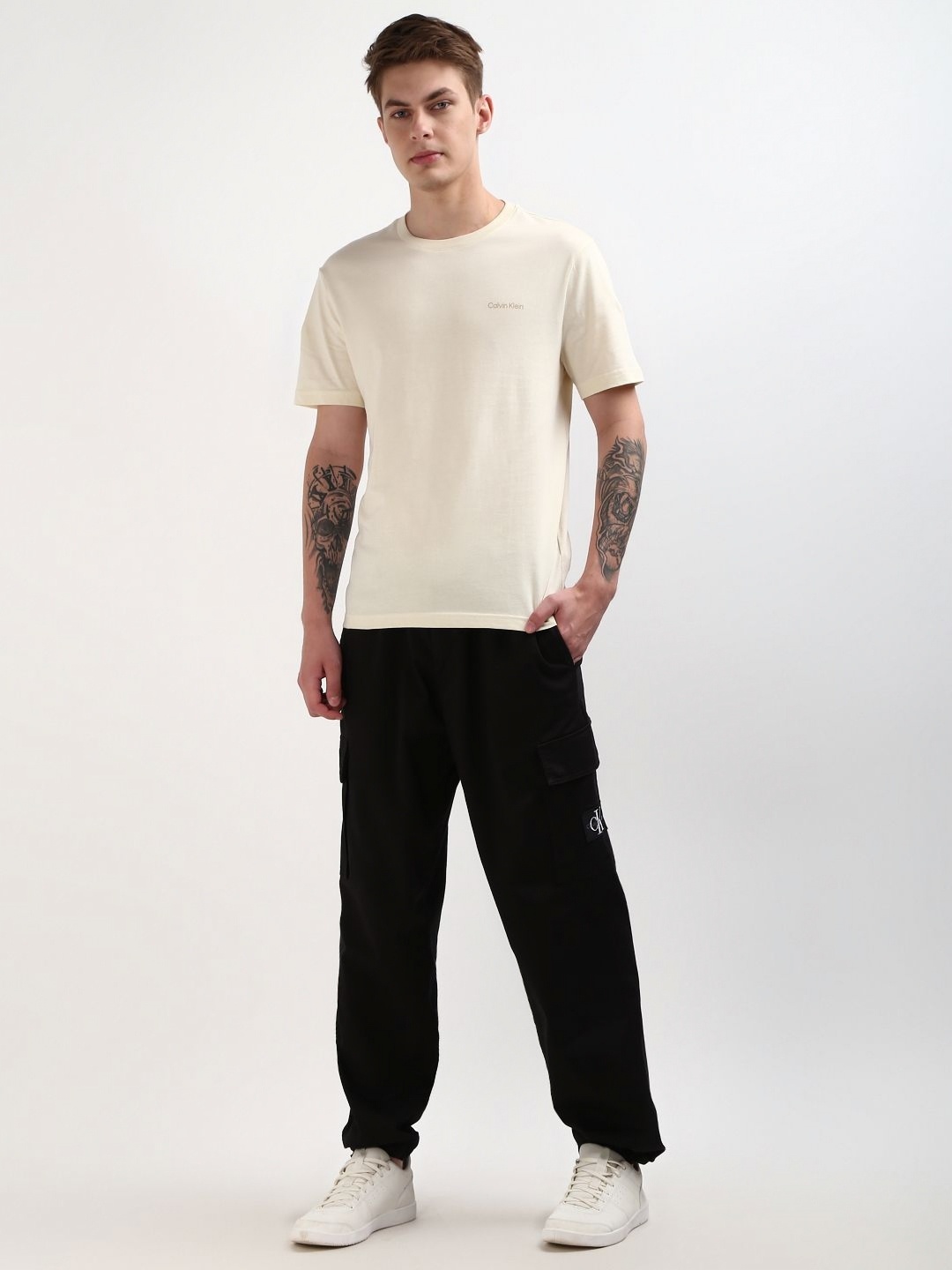 

Calvin Klein Jeans Men Solid Round Neck Cotton T-Shirt, Beige