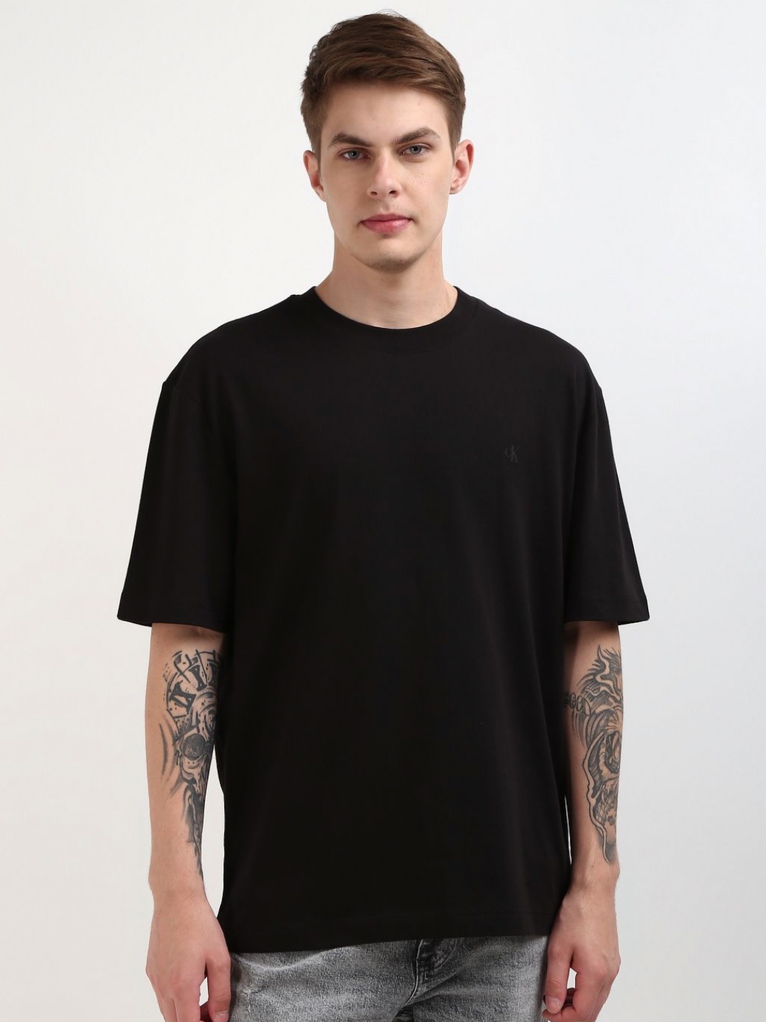 

Calvin Klein Men Solid Round Neck Cotton Oversized T-Shirt, Black