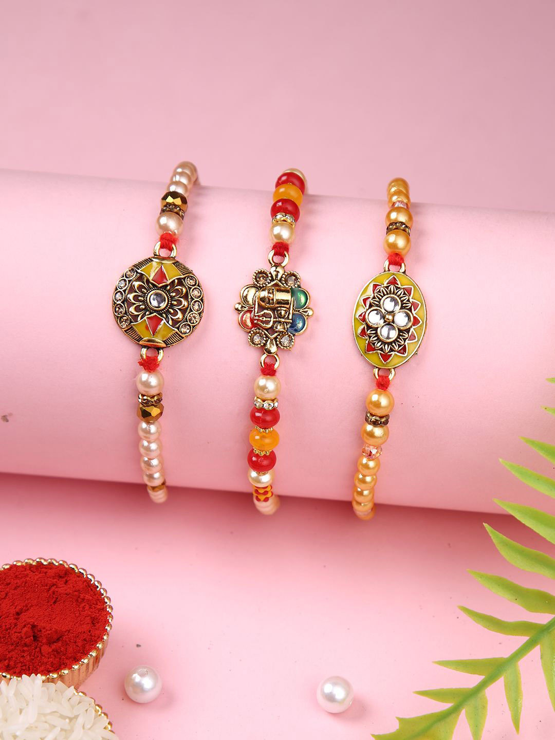 

Aapno Rajasthan Set of 3 Beaded Thread Rakhis with Roli Chawal & Greetings Card, Red